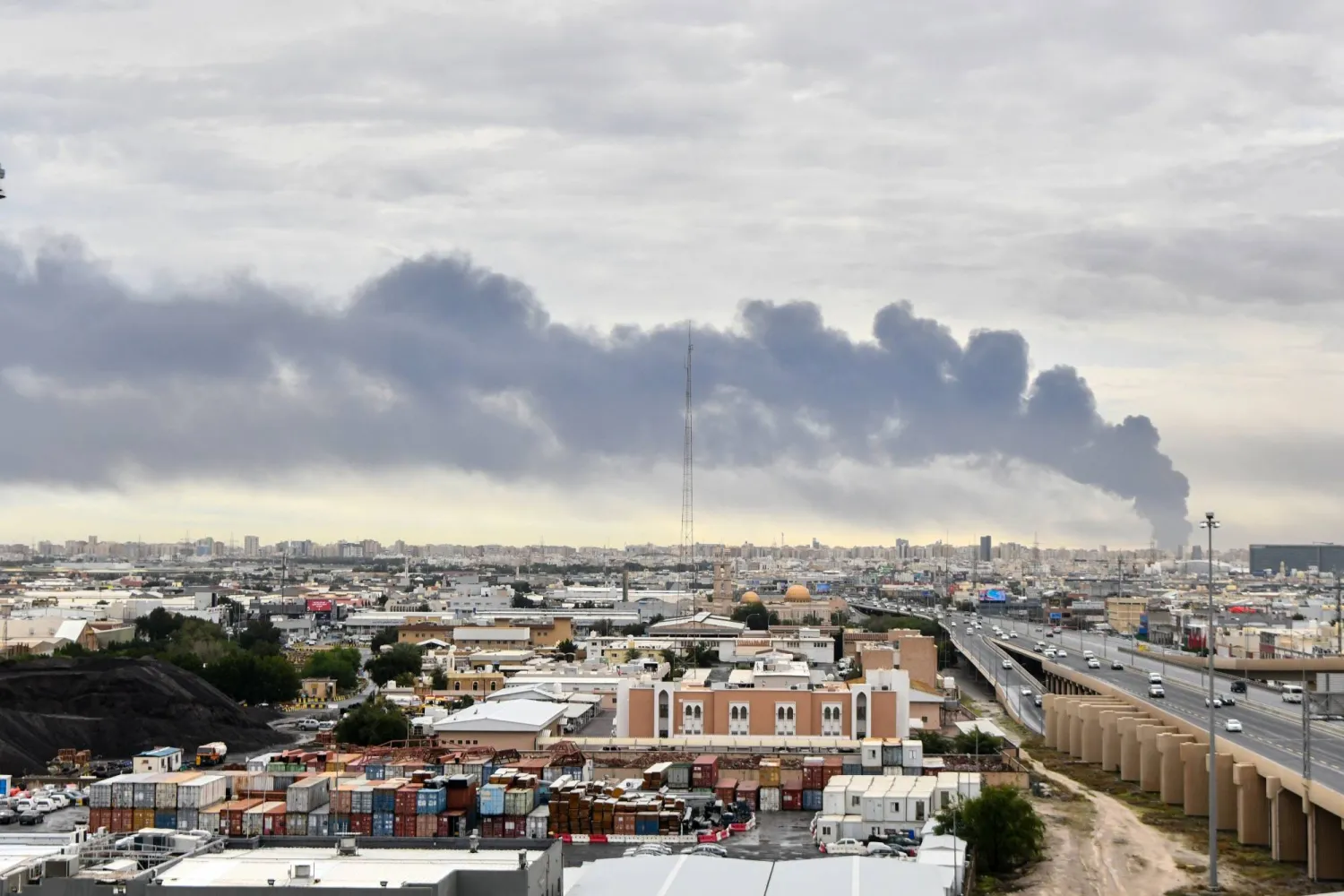 Smoke rises from Kuwait international airport after a drone strike on fuel storage in Kuwait City, Kuwait, Friday, Wednesday, March 25, 2026. (AP Photo)