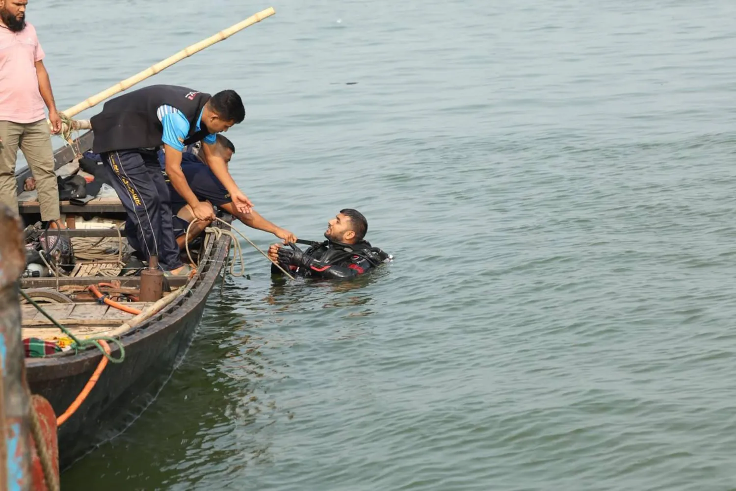 Rescue teams conduct search operations and look for victims, a day after a bus plunged into the Padma River while boarding a ferry in Rajbari district, 84 km from Dhaka, Bangladesh, 26 March 2026. EPA/STR