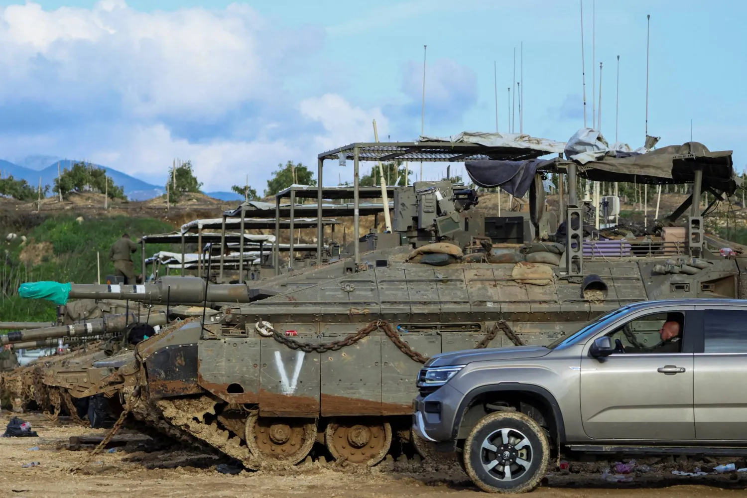 Israeli tanks near the Israeli side of the border with Lebanon, amid escalating hostilities between Israel and Hezbollah, as the US-Israeli conflict with Iran continues, in northern Israel, March 25, 2026. REUTERS/Tyrone Siu