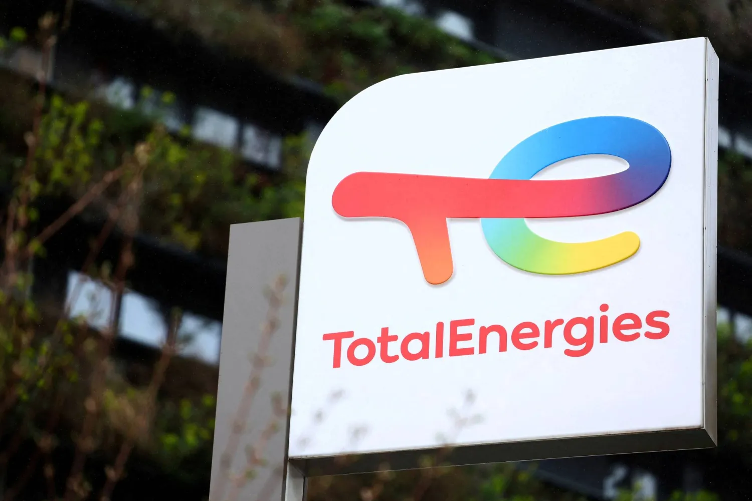 FILE PHOTO: The logo of French oil and gas company TotalEnergies is seen at a petrol station in Paris, France, March 25, 2026. REUTERS/Abdul Saboor/File Photo