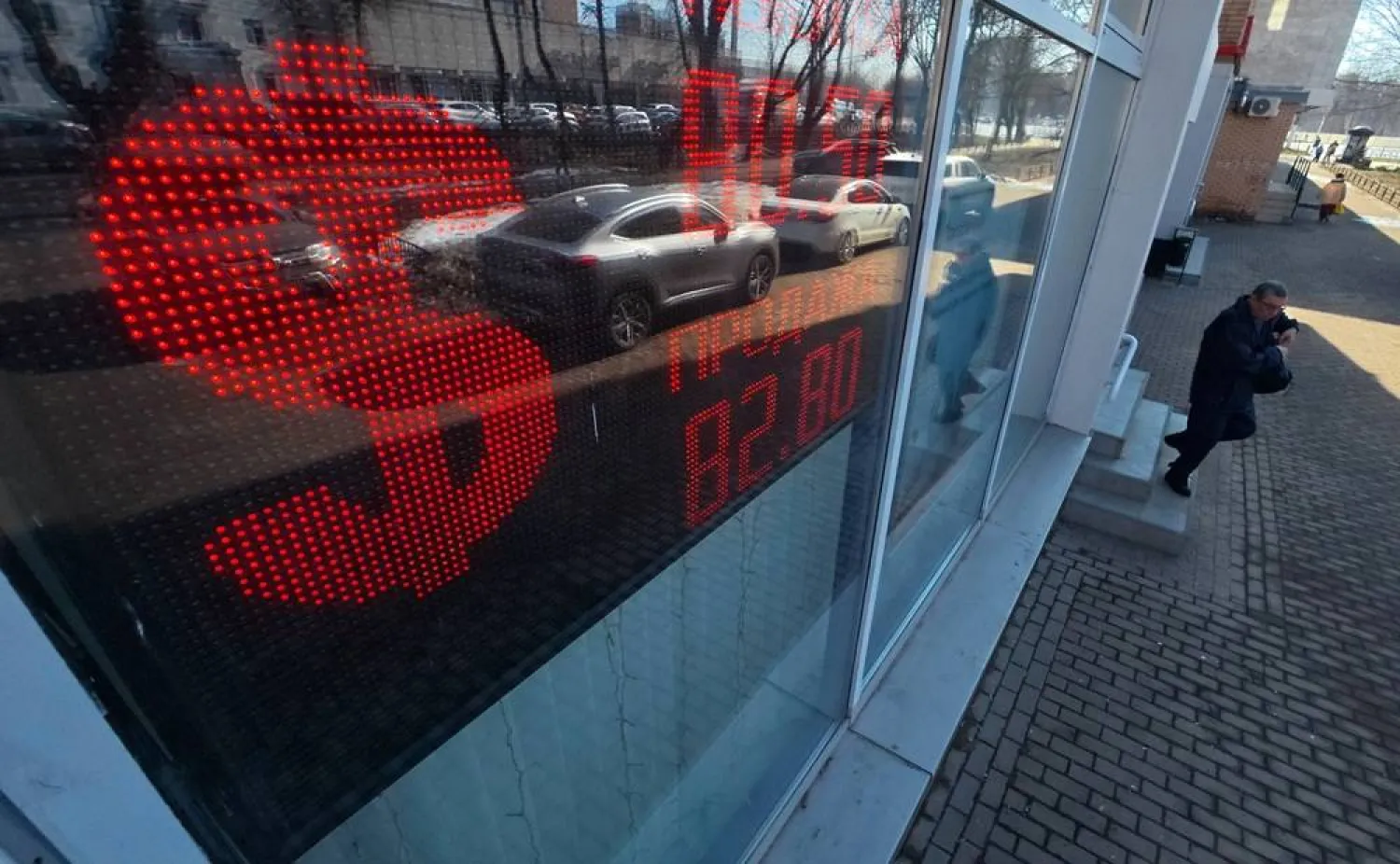 An electronic panel displays US Dollar currency symbol at an exchange office in Podolsk, outside Moscow, Russia, 26 March 2026. (EPA)