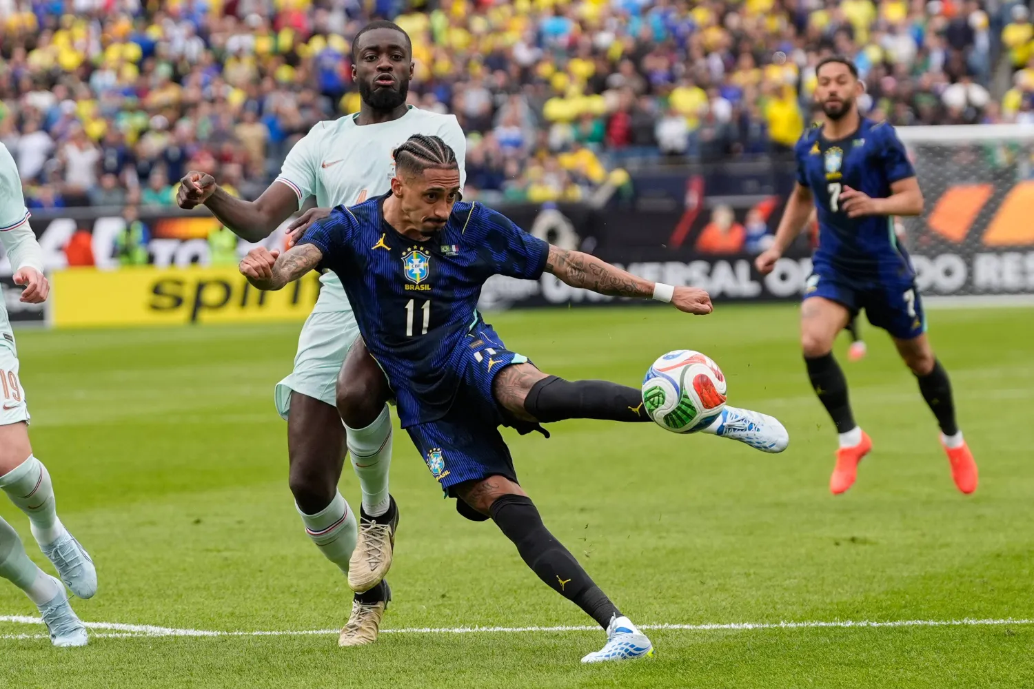 Brazil's Raphinha takes a shot during the international friendly soccer match between Brazil and France in Foxborough, Mass, Thursday, March 26, 2026. (AP Photo/Charles Krupa)