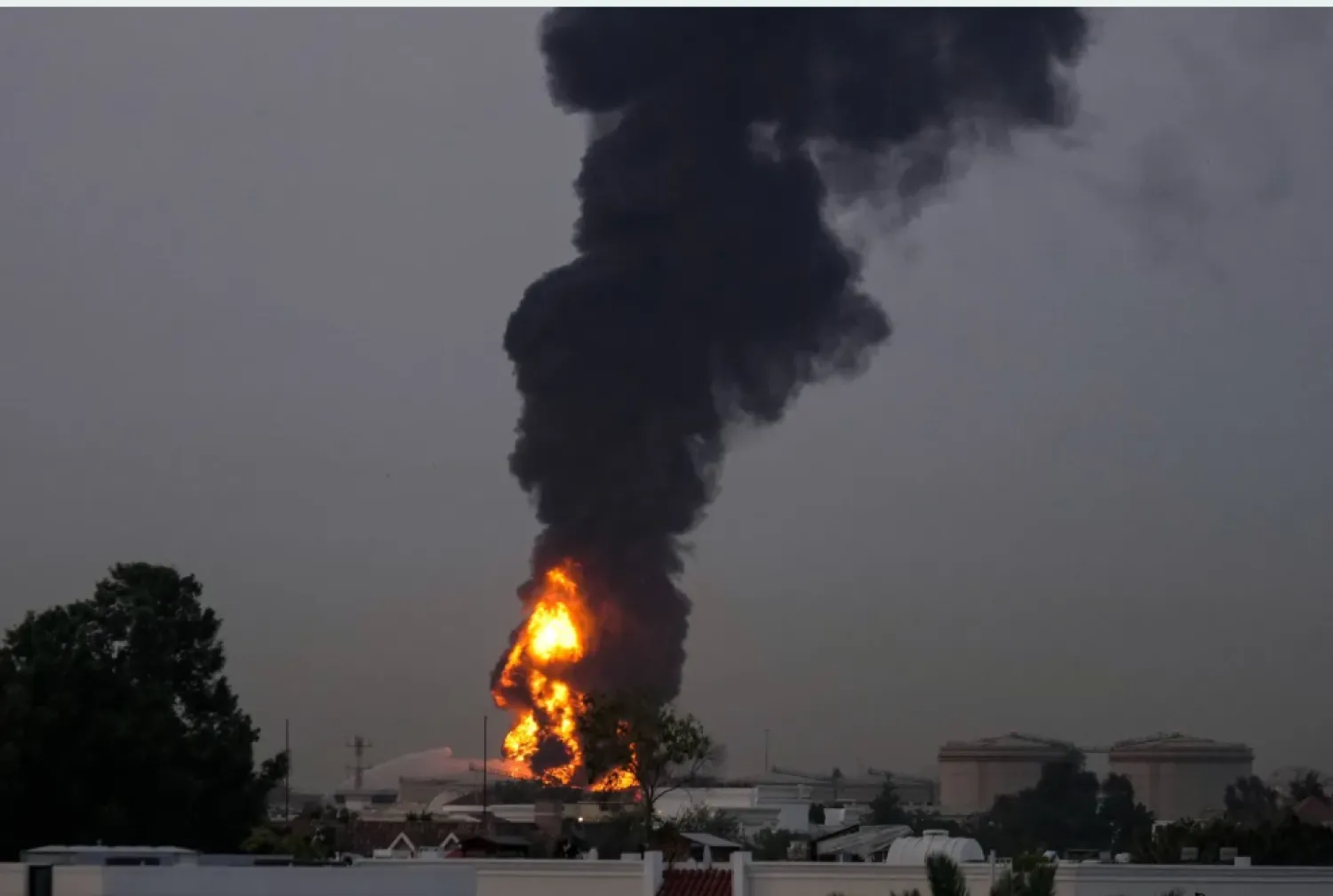 File photo of smoke rising after a fuel tank was targeted by a drone near Dubai International Airport (AP)
