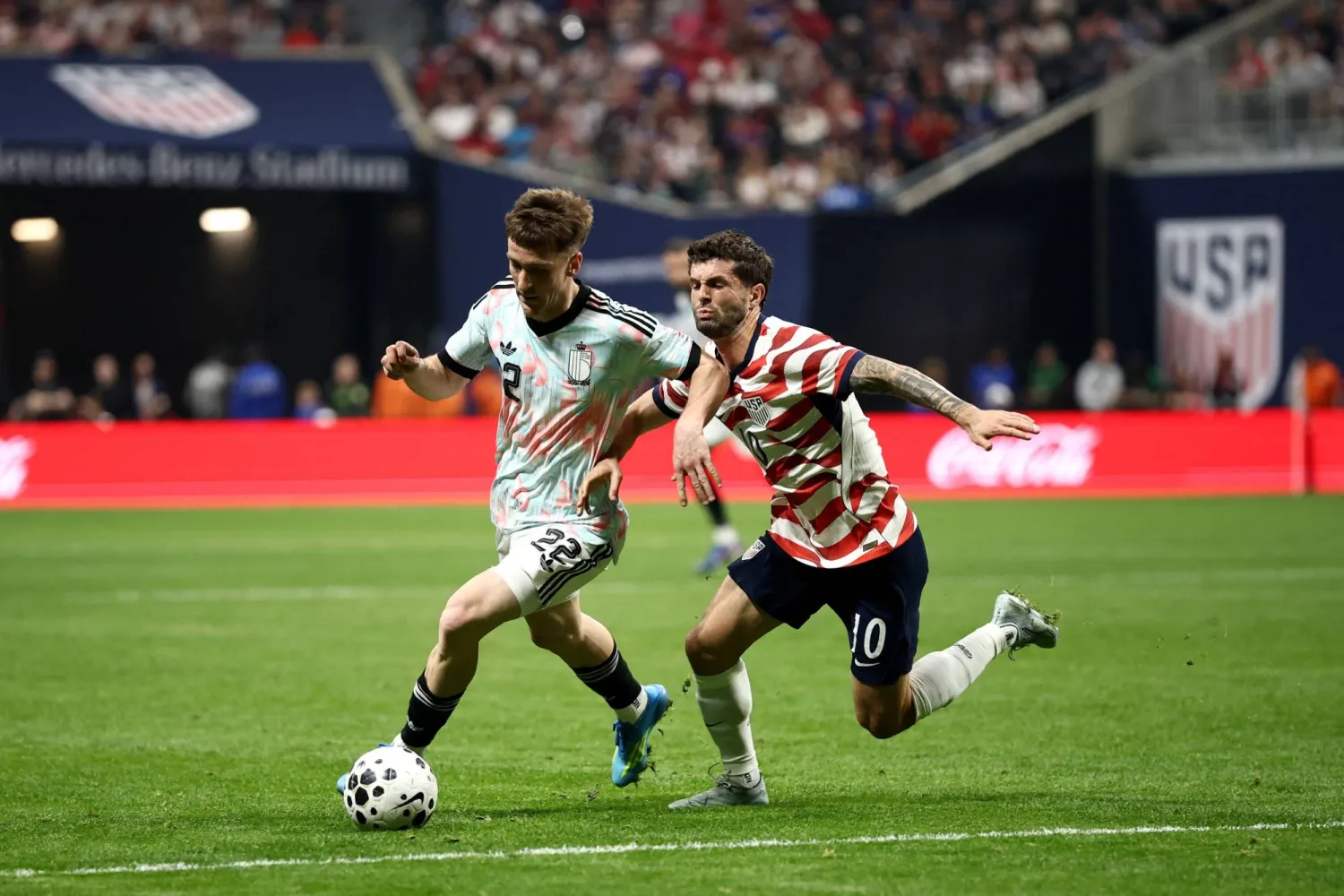 Alexis Saelemaekers #22 of Belgium is challenged by Christian Pulisic #10 of the United States during the International Friendly match between United States and Belgium at Mercedes-Benz Stadium on March 28, 2026 in Atlanta, Georgia. (Getty Images/AFP) 