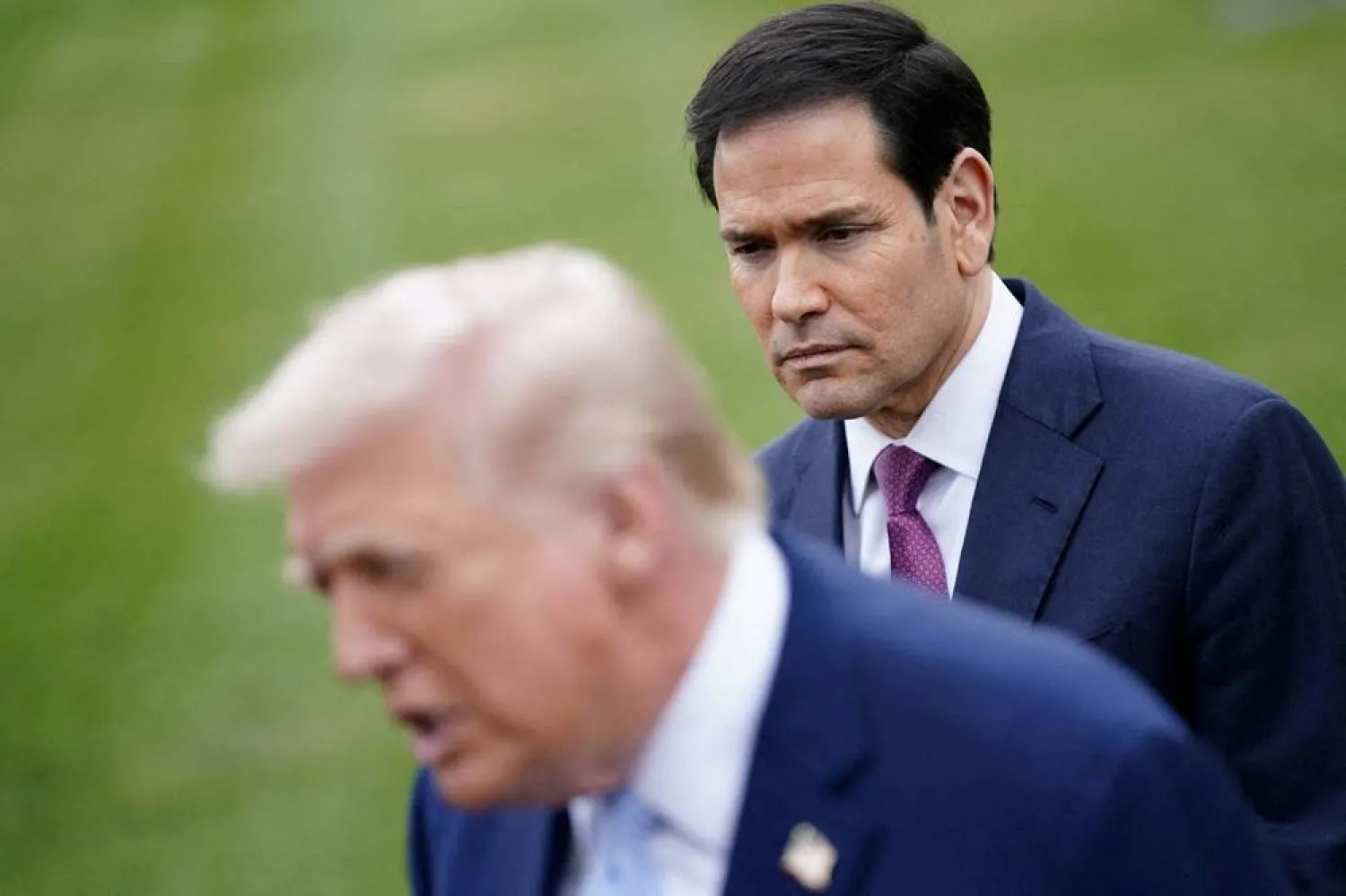  US Secretary of State Marco Rubio listens to US President Donald Trump speaking to the media, as Trump departs the White House for Florida, in Washington, DC, US, March 20, 2026. (Reuters)