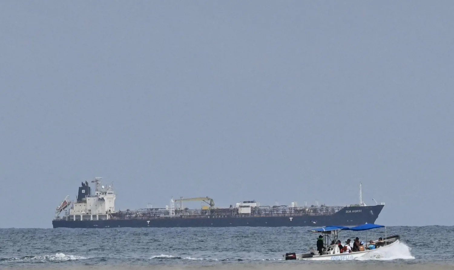 This view shows the crude oil tanker Sea Horse, flag of Hong Kong and carrying about 200,000 barrels of Russia-origin fuel originally bound for Cuba, at the coast of Puerto Cabello, Venezuela, on March 29, 2026. (Photo by Maryorin Mendez / AFP)
