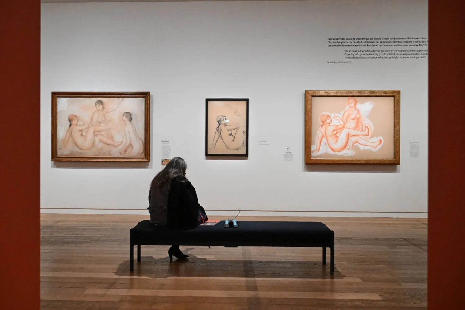 A visitor looks at works by Auguste Renoir during the press review of the exhibition 'Renoir the draughtsman at 'the Orsay museum, Monday, March 16, 2026, in Paris, France. (AP Photo/Emma Da Silva)