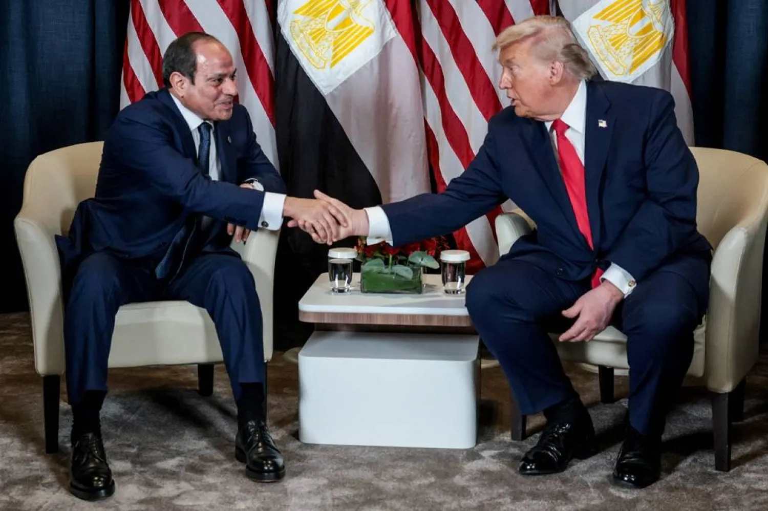 US President Donald Trump shakes hands with Egyptian President Abdel Fattah al-Sisi during a bilateral meeting at the World Economic Forum (WEF) in Davos, Switzerland, January 21, 2026. (Reuters) 