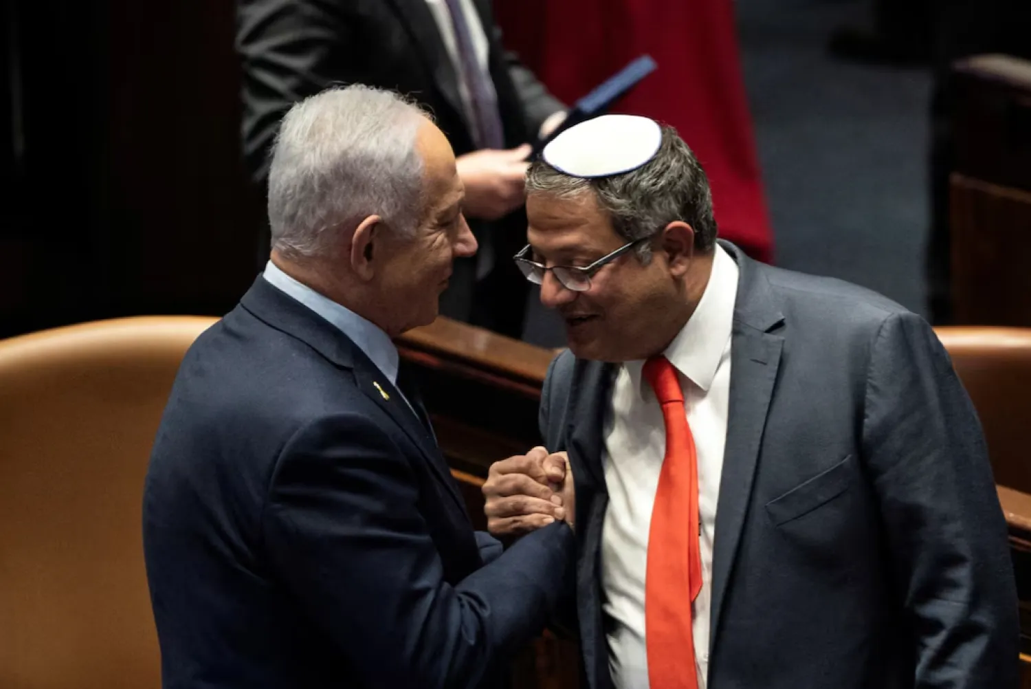 Israel Prime minister Benjamin Netanyahu and Itamar Ben Gvir shake hands as the Israeli government approve Netanyahu's proposal to reappoint Itamar Ben-Gvir as minister of National Security, in the Knesset, Israeli parliament in Jerusaelm, March 19, 2025 REUTERS/Oren Ben Hakoon