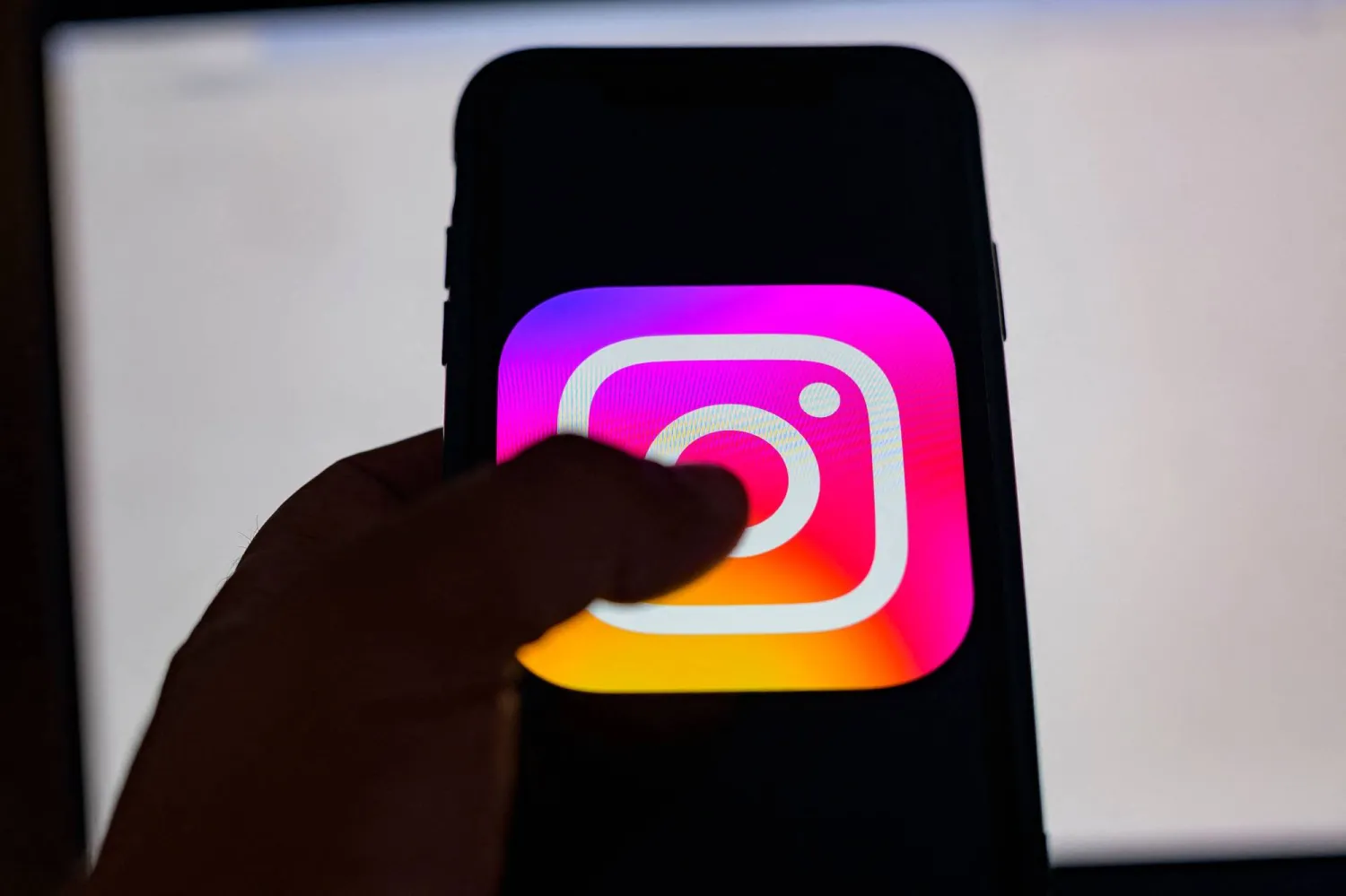 (FILES) This picture taken in Istanbul on August 2, 2024, shows the logo of the social network Instagram on a smartphone. (Photo by Yasin AKGUL / AFP)