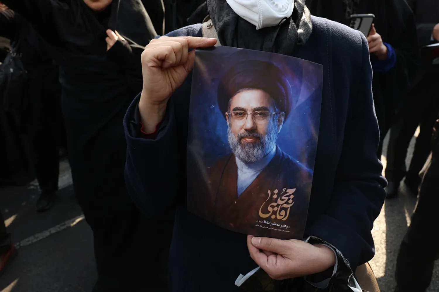 A person holds a picture of the new Iranian Supreme Leader Mojtaba Khamenei during a gathering in support of him in Tehran, Iran, 09 March 2026. (EPA) 