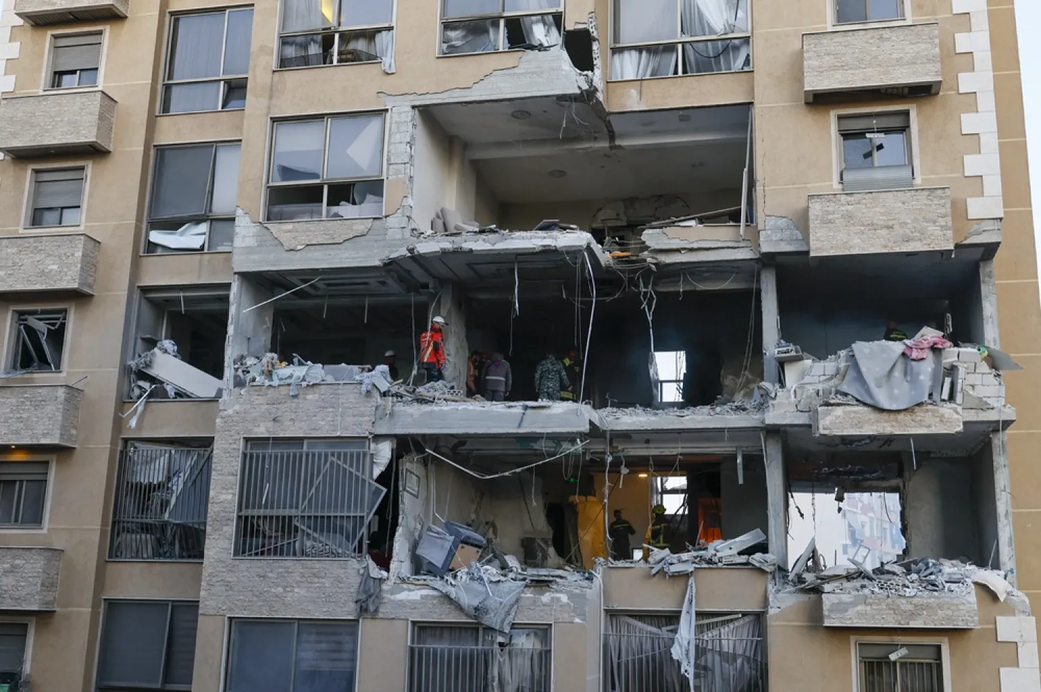 Emergency services inspect the damage after an Israeli strike targeted an apartment at a building in the Aisha Bakkar neighborhood, Beirut, Lebanon, 11 March 2026. (EPA)
