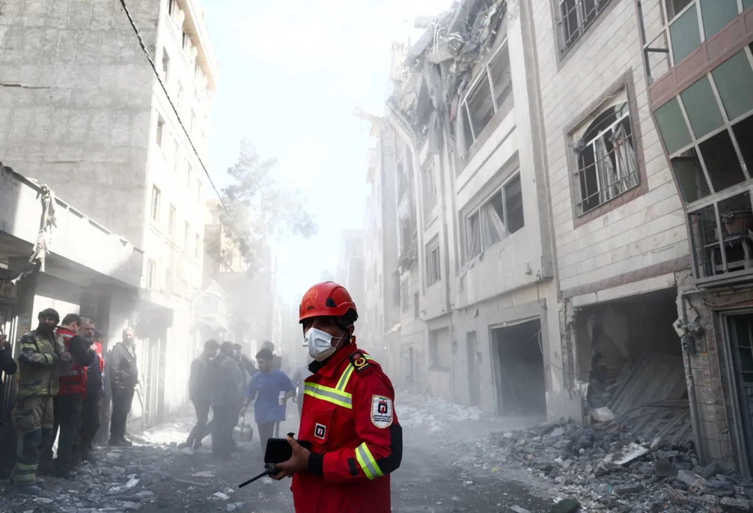 Emergency responders inspect the site of a residential building damaged by a strike, amid the US-Israeli conflict with Iran, in Tehran, Iran, March 27, 2026. Majid Asgaripour/WANA (West Asia News Agency) via Reuters 