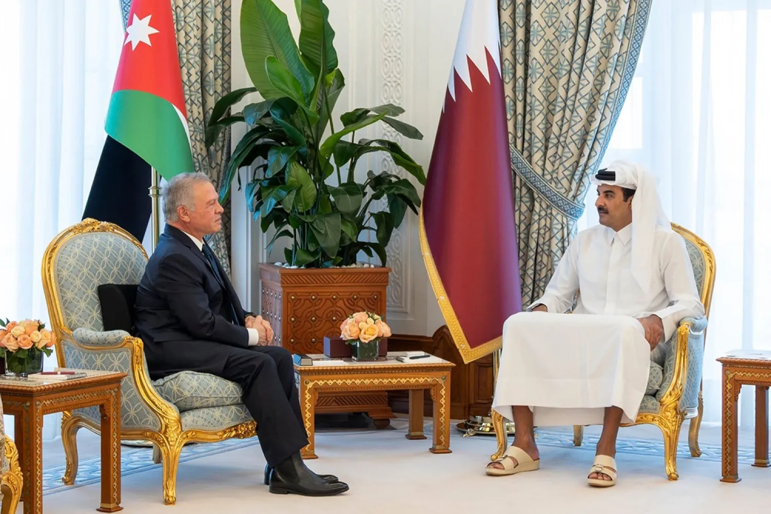 This handout picture released by Qatar's Amiri Diwan on March 17, 2026, shows Qatar's Sheikh Tamim bin Hamad al-Thani (R) meeting with Jordan's King Abdullah II, at the Diwan in Doha. (Qatar Amiri Diwan / AFP) 