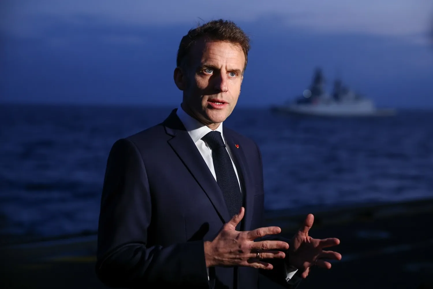  French President Emmanuel Macron speaks to members of the media as he visits the French aircraft carrier Charles de Gaulle, during his visit to Cyprus, Monday March 9, 2026. (Gonzalo Fuentes/Pool Photo via AP) 