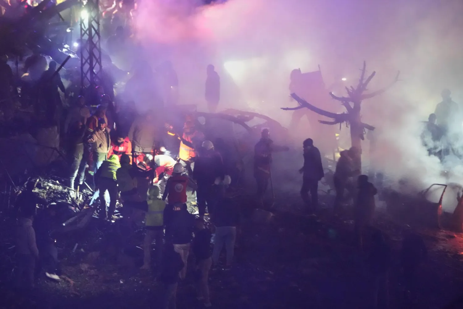 Rescue workers inspect the scene of Israeli airstrikes, in Beirut, Lebanon, Wednesday, April 1, 2026. (AP Photo/Hussein Malla)