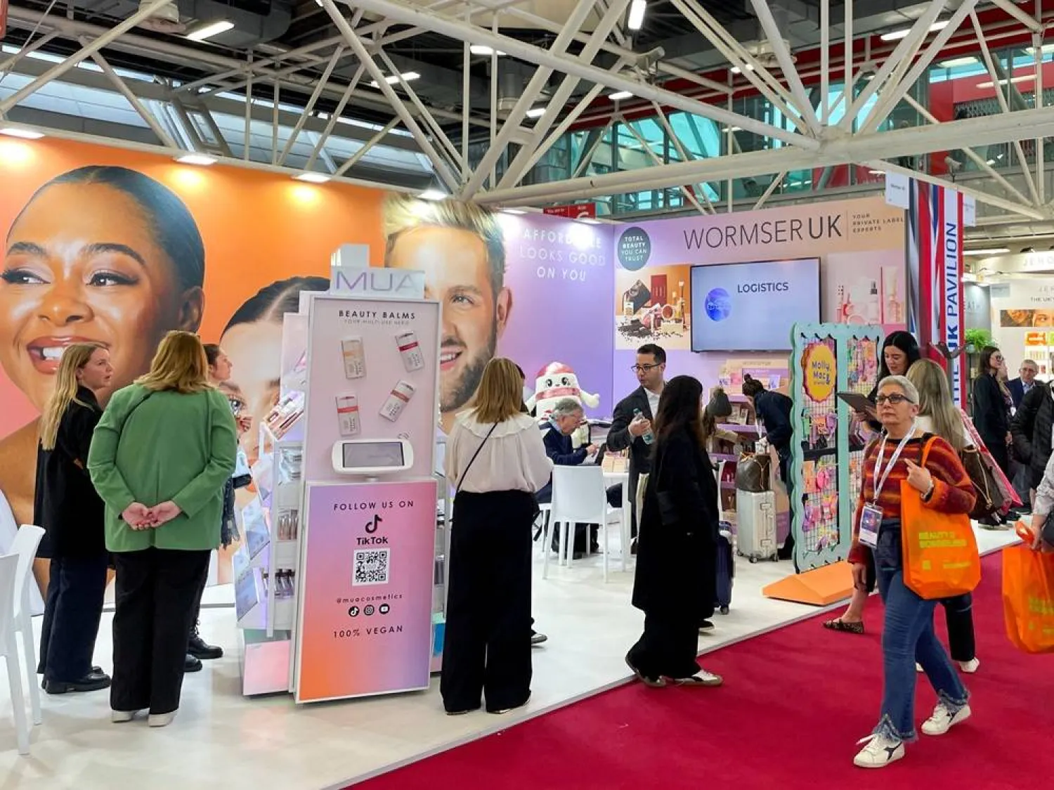 Visitors browse stalls at the beauty industry Cosmoprof trade show, in Bologna, Italy, March 26, 2026. Picture taken with a mobile phone. (Reuters) 