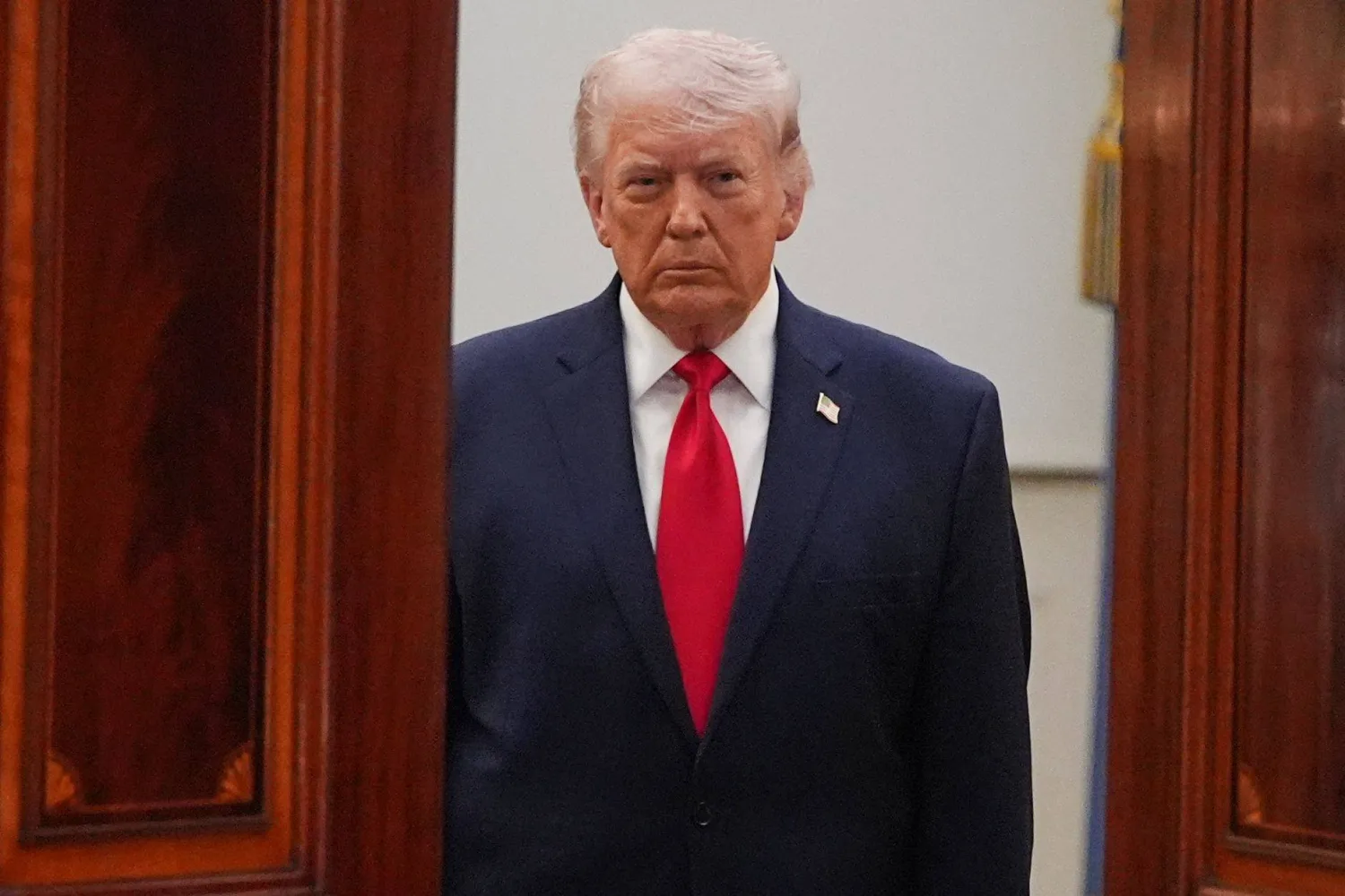 US President Donald Trump arrives to speak at a televised address on the conflict in the Middle East from the Cross Hall of the White House in Washington, DC on April 1, 2026. (Photo by Alex Brandon / POOL / AFP) 