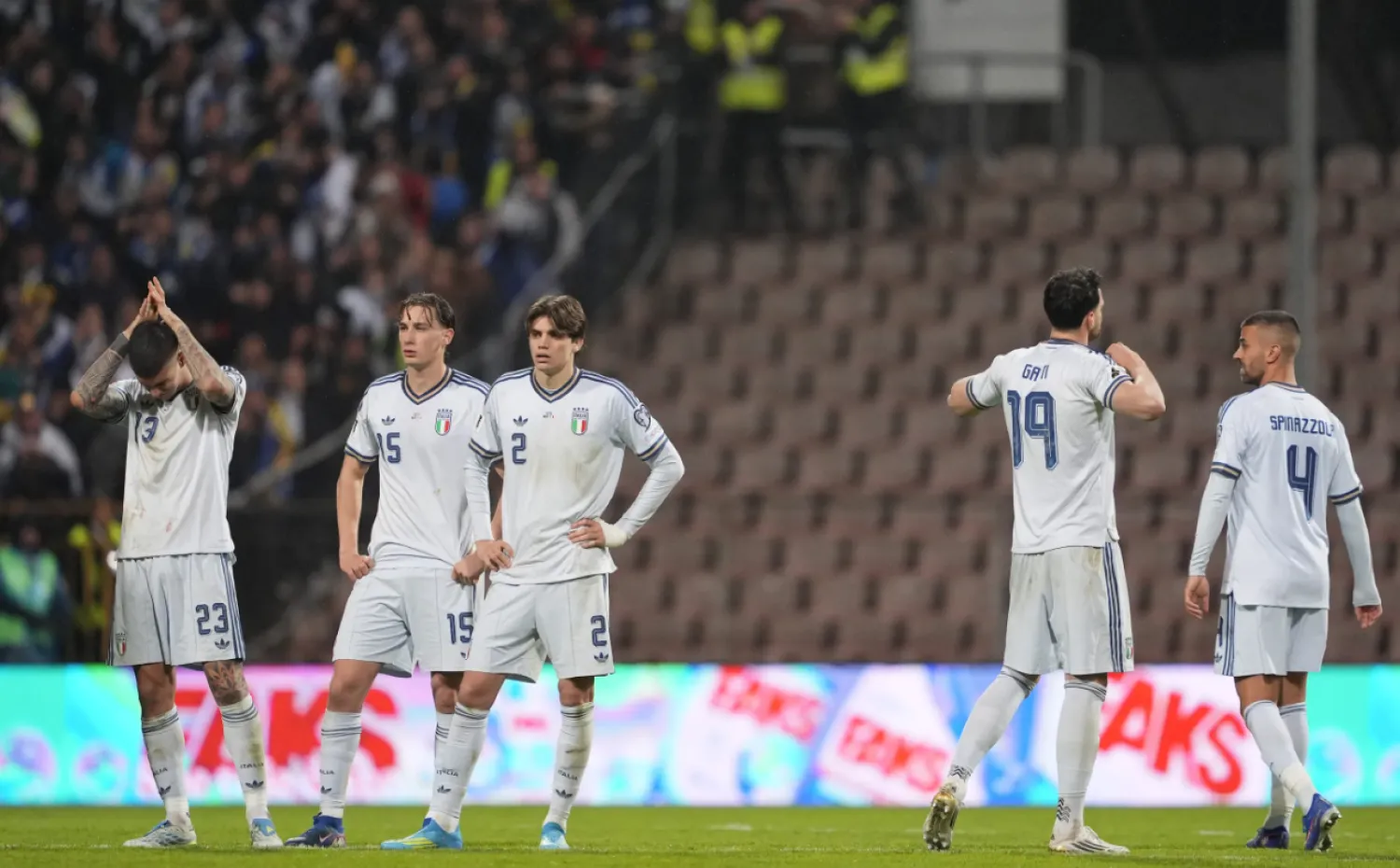 Italy players react after losing in a World Cup qualifying playoff final soccer match between Bosnia and Italy in Zenica, Bosnia, Tuesday, March 31, 2026. (Fabio Ferrari/LaPresse via AP)