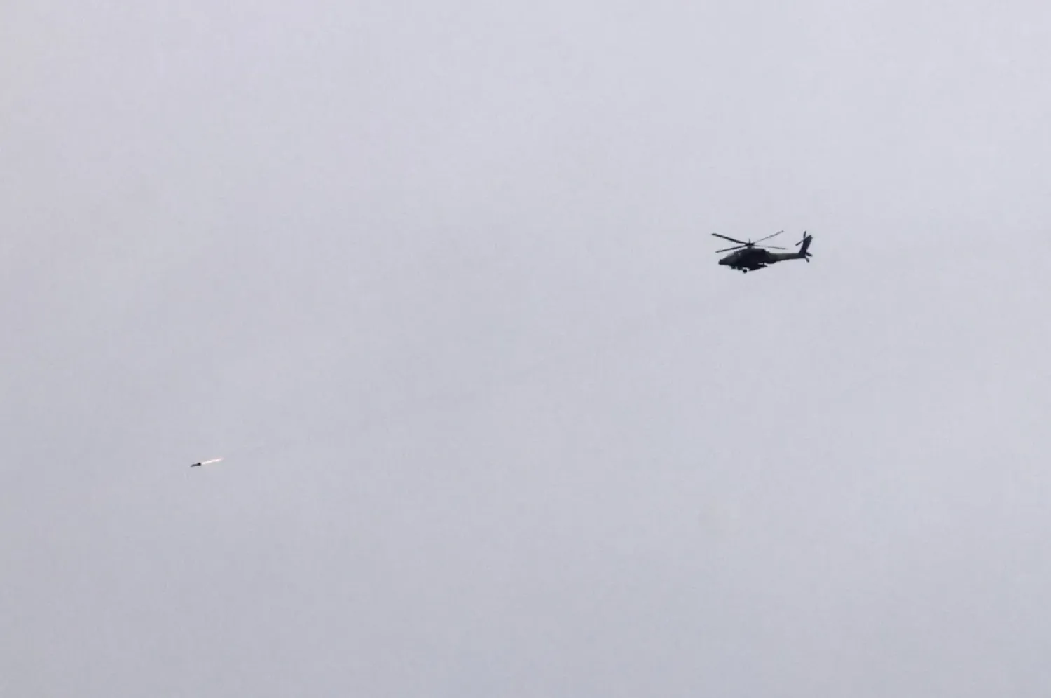 An Israeli helicopter flying in Israeli airspace near the border with Lebanon (EPA)
