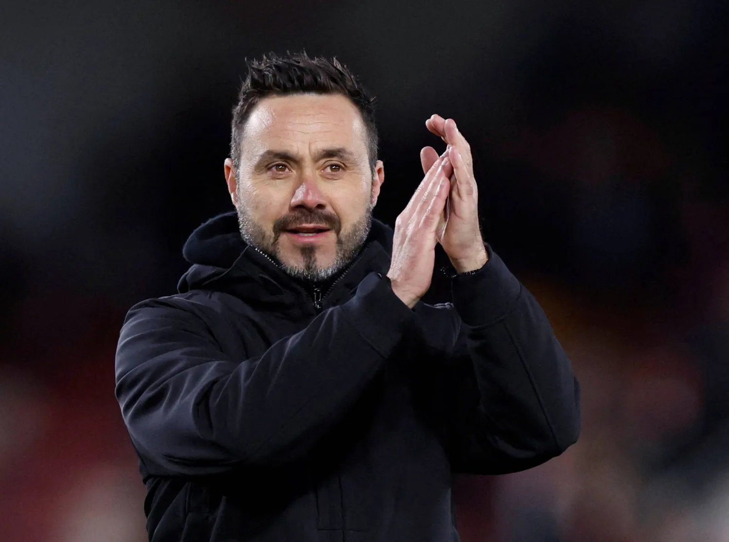 Football - Premier League - Brentford v Brighton & Hove Albion - Brentford Community Stadium, London, Britain - April 3, 2024 Brighton & Hove Albion manager Roberto De Zerbi applauds fans after the match. (Action Images via Reuters)