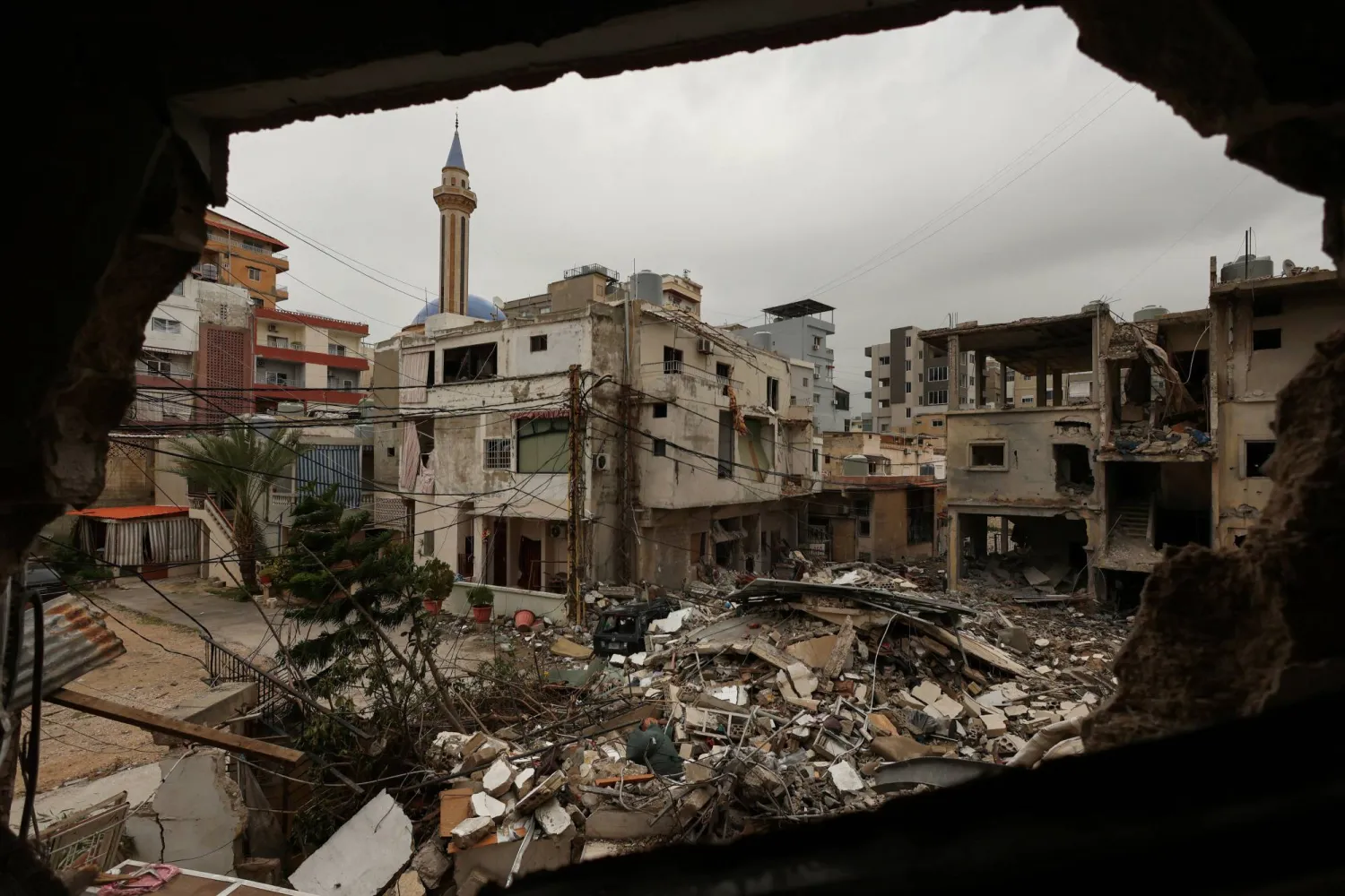 The rubble of a destroyed building, seen from inside a heavily damaged building, after an Israeli strike, amid escalating hostilities between Israel and Hezbollah, as the US-Israeli conflict with Iran continues, in Tyre, Lebanon, April 2, 2026. REUTERS/Yara Nardi
