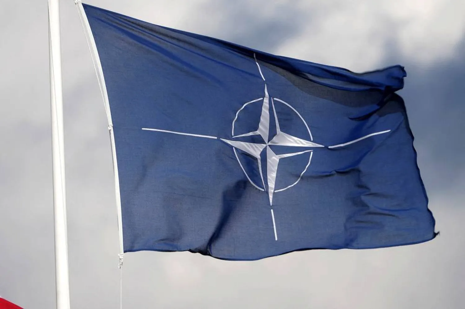 A NATO flag flutters at the Tapa military base, Estonia April 30, 2023. (Reuters)
