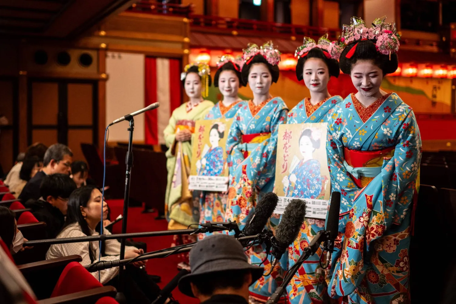  Maiko (apprentice geisha) take part in a press interview ahead a rehearsal for the annual "Miyako Odori" -- which means "capital city dance" in Japanese, at the Gion Kobu Kaburenjo in Kyoto on March 31, 2026. (AFP) 