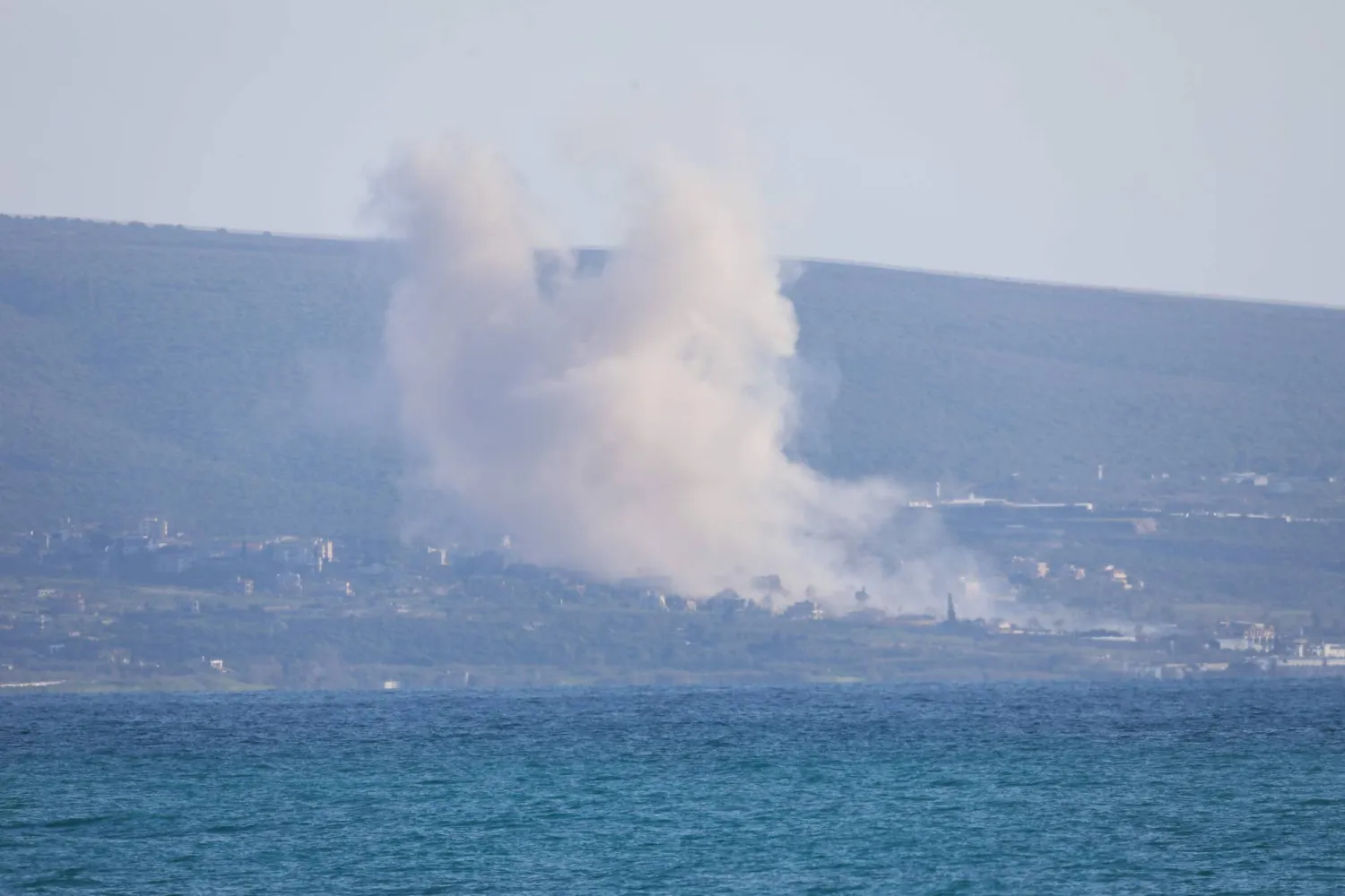 This picture taken from the southern Lebanese area of Tyre shows smoke rising from the site of an Israeli airstrike that targeted the area of Naqoura on March 31, 2026. (AFP)