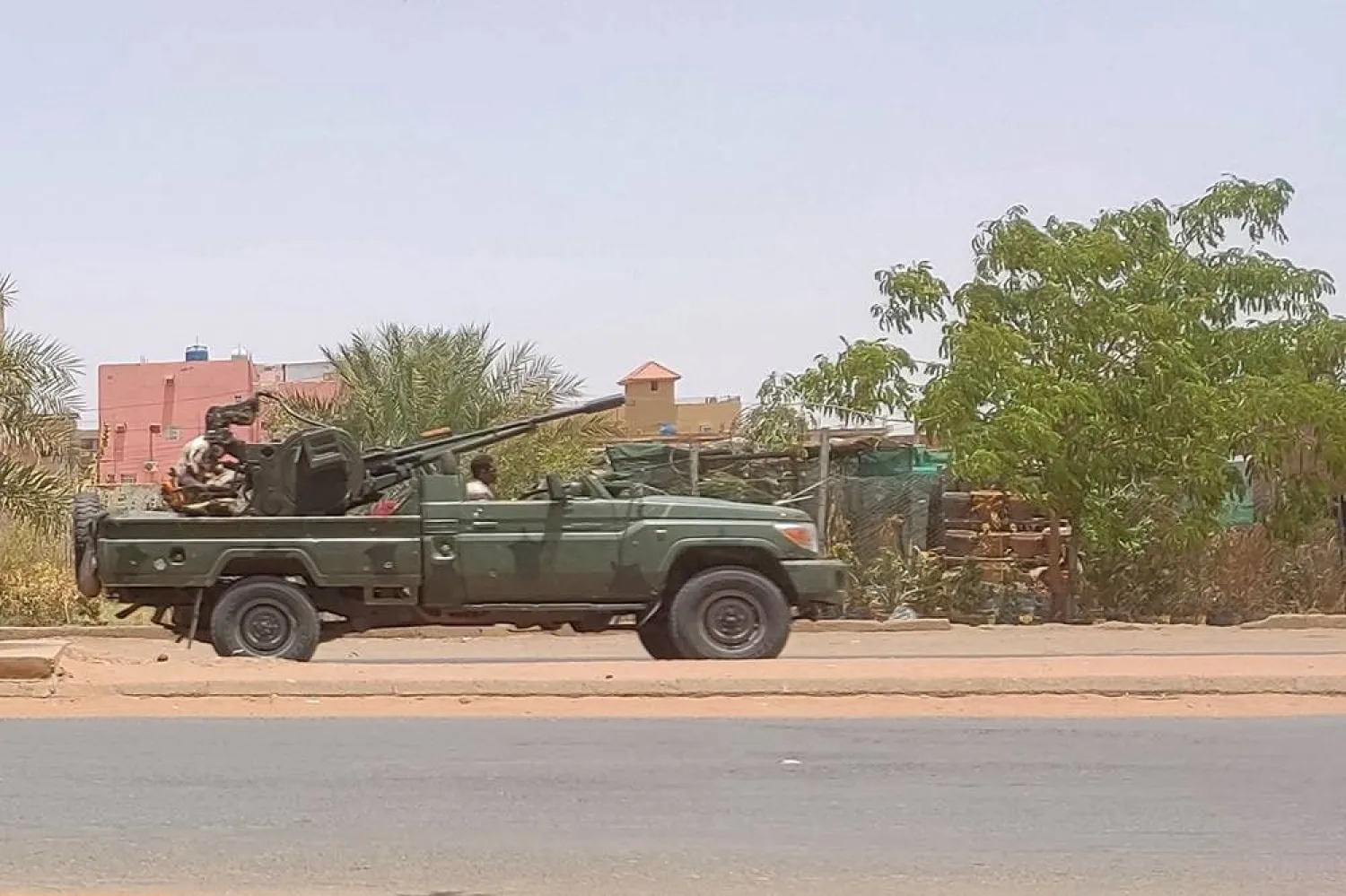 Fighters of the paramilitary Rapid Support Forces (RSF) drive an armored vehicle in Khartoum in 2023. (AFP) 