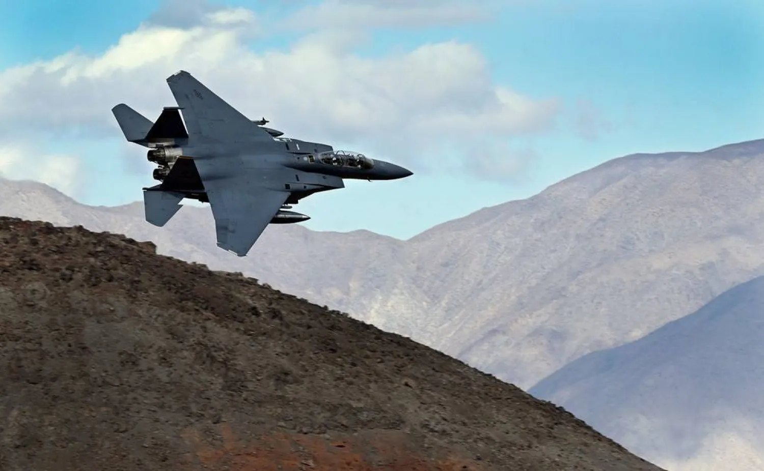 An F-15E Strike Eagle turns toward the Panamint range over Death Valley National Park, Calif., on Feb. 27, 2017. (AP)