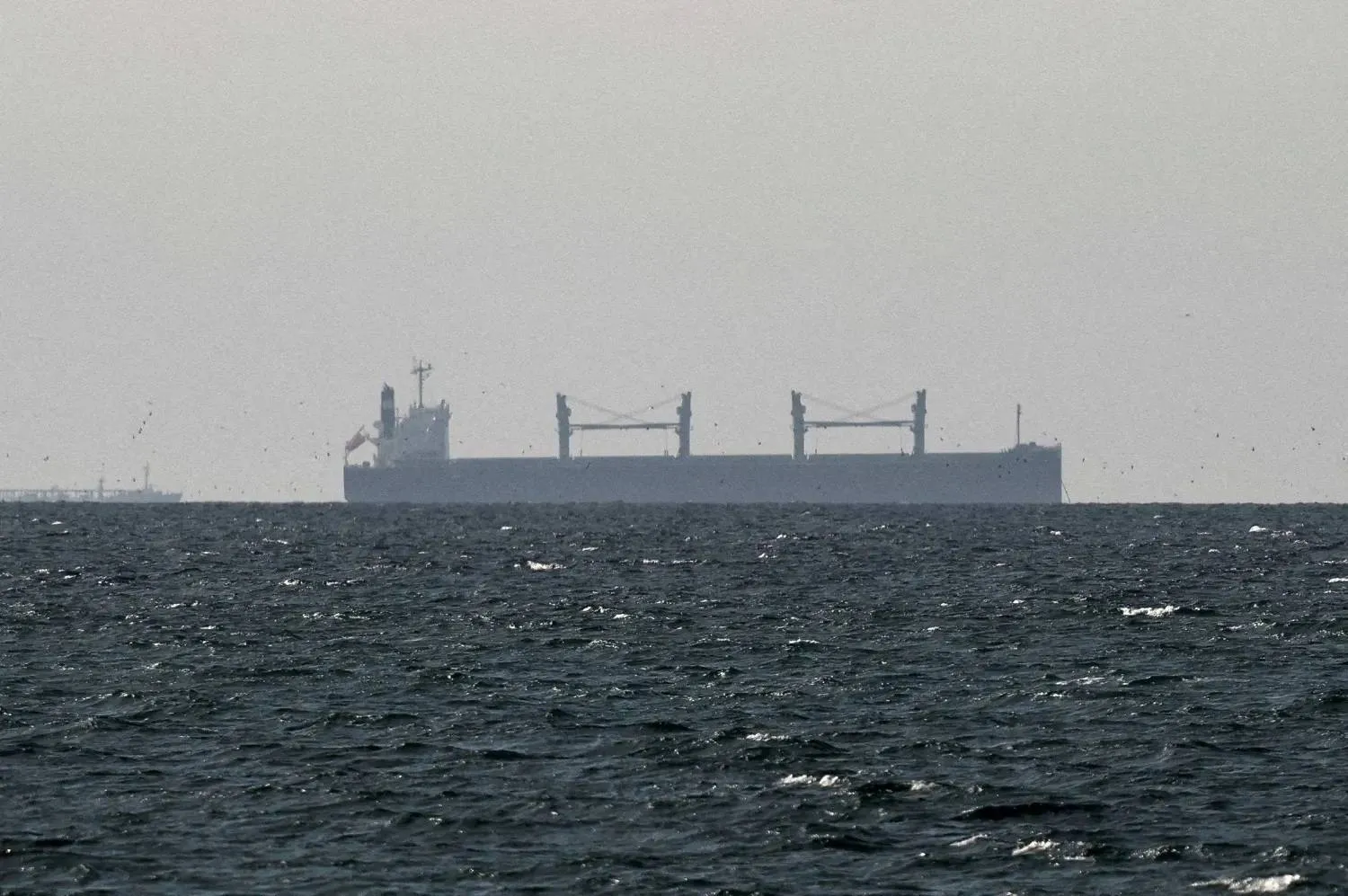 A cargo ship in the Gulf, near the Strait of Hormuz, as seen from northern Ras al-Khaimah, near the border with Oman’s Musandam, amid the US-Israeli conflict with Iran, in United Arab Emirates, March 11, 2026. (Reuters file) 