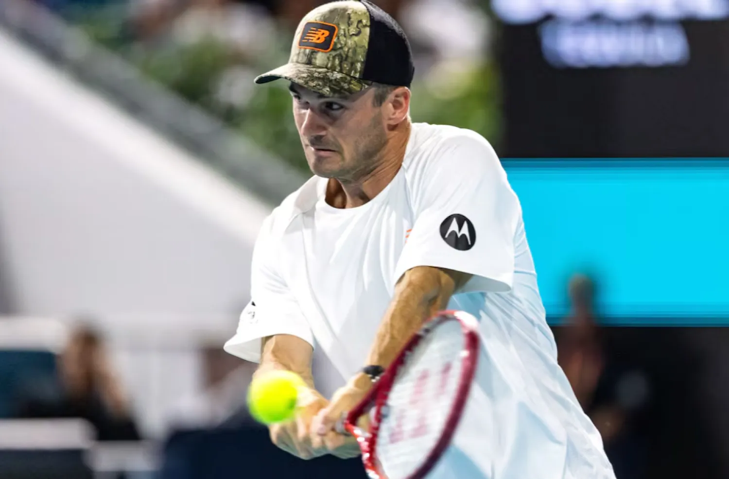 Mar 25, 2026; Miami Gardens, FL, USA; Tommy Paul of the United States hits a backhand during his match against Arthur Fils of France in the quarter finals of the men’s singles at the Miami Open at Hard Rock Stadium. Mandatory Credit: Mike Frey-Imagn Images - Reuters