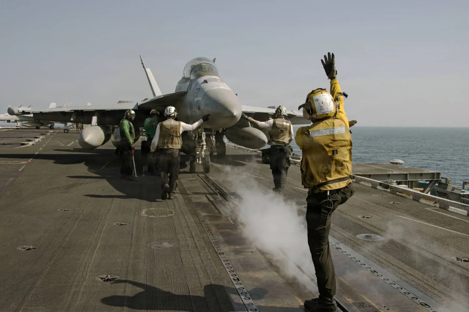 16 March 2026, Undisclosed location: A US Navy EA-18G Growler electronic warfare aircraft, assigned to the 'Wizards' of Electronic Attack Squadron 133, is signaled to hold for launch on the flight deck of the USS Abraham Lincoln during Operation Epic Fury on March 7, 2026. Photo: Navy /U.S. Navy/Planet Pix via ZUMA Press Wire/dpa