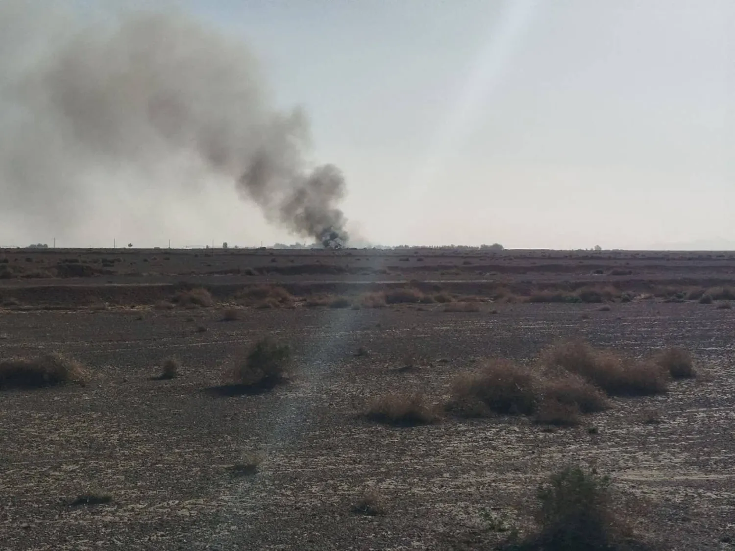 A still image purporting to show smoke rising from the site of the US aircraft destroyed during the US mission to find a stranded airman in Iran, the Revolutionary Guards said according to Iranian media, amid the US-Israeli conflict with Iran, in Isfahan, Iran, released on April 5, 2026. (Social Media/via Reuters)