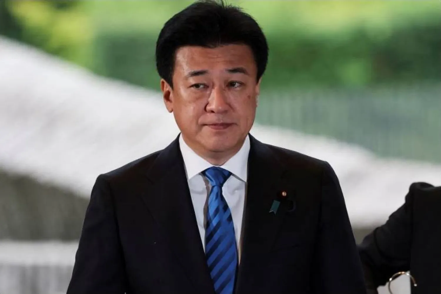 Japanese government spokesman Minoru Kihara (Reuters)