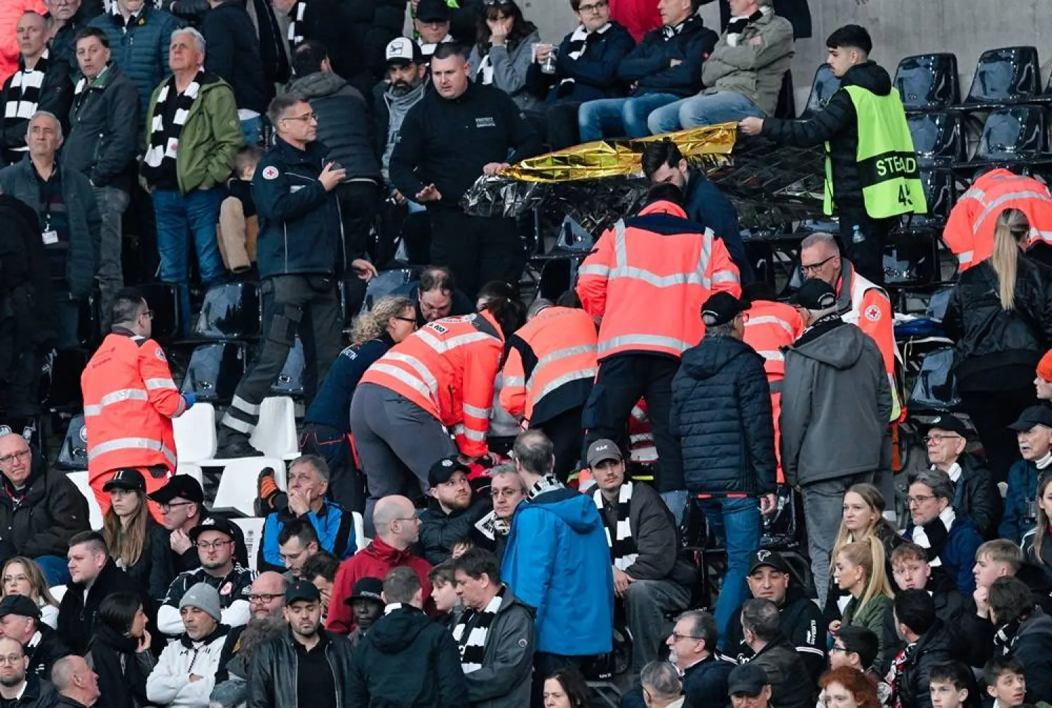 05 April 2026, Hesse, Frankfurt_Main: Emergency medical response in the stands during the German Bundesliga soccer match between Eintracht Frankfurt and 1. FC Cologne at Deutsche Bank Park. (dpa) 