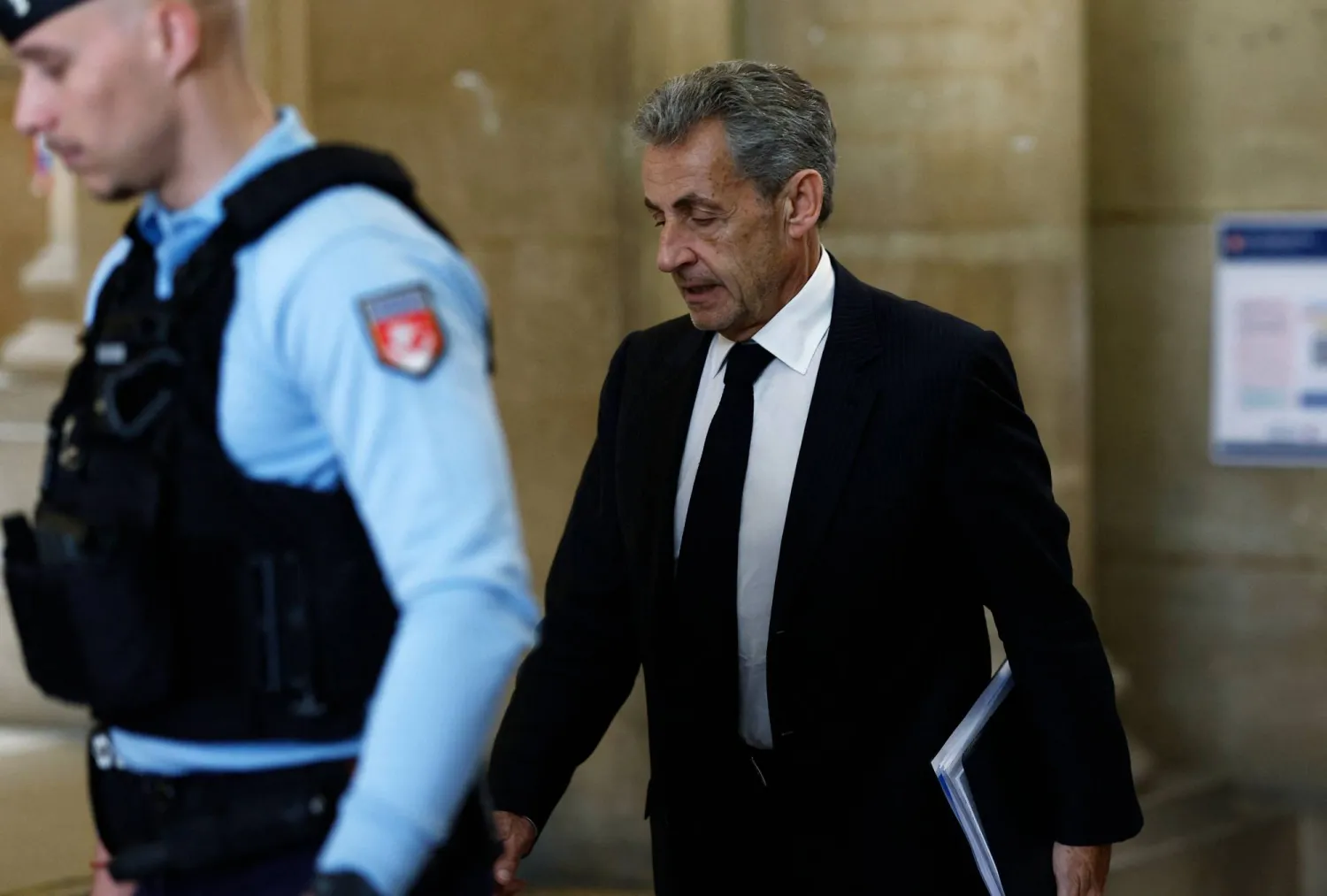 Former France's President Nicolas Sarkozy returns to the courtroom following a recess in his appeal trial over charges he sought Libyan financing for his 2007 election, at the Palais de Justice courthouse in Paris on April 7, 2026. (AFP)