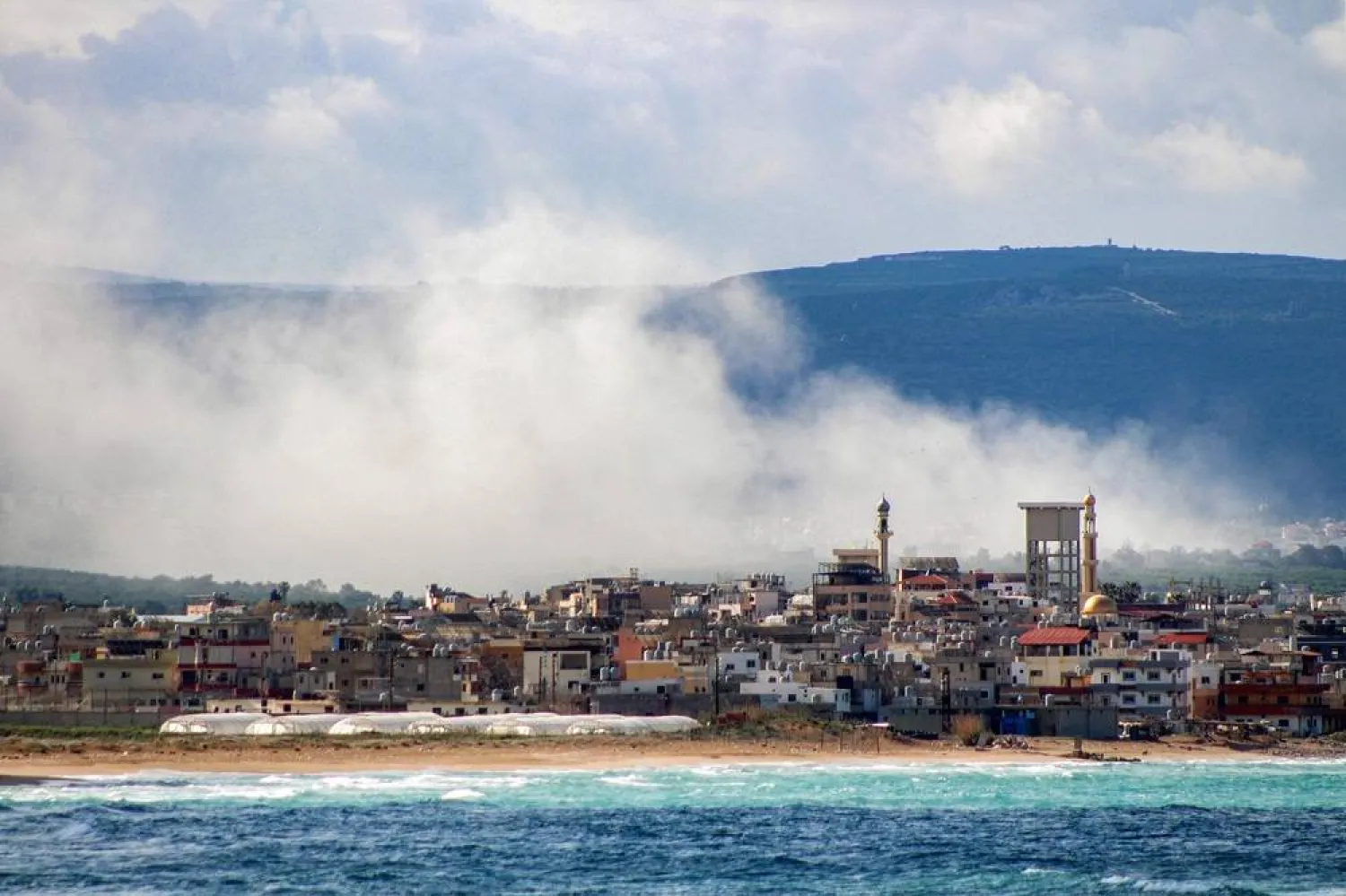 Smoke rises following Israeli bombardment on the village of Qlaile as pictured from nearby Tyre in southern Lebanon on April 7, 2026. (AFP)