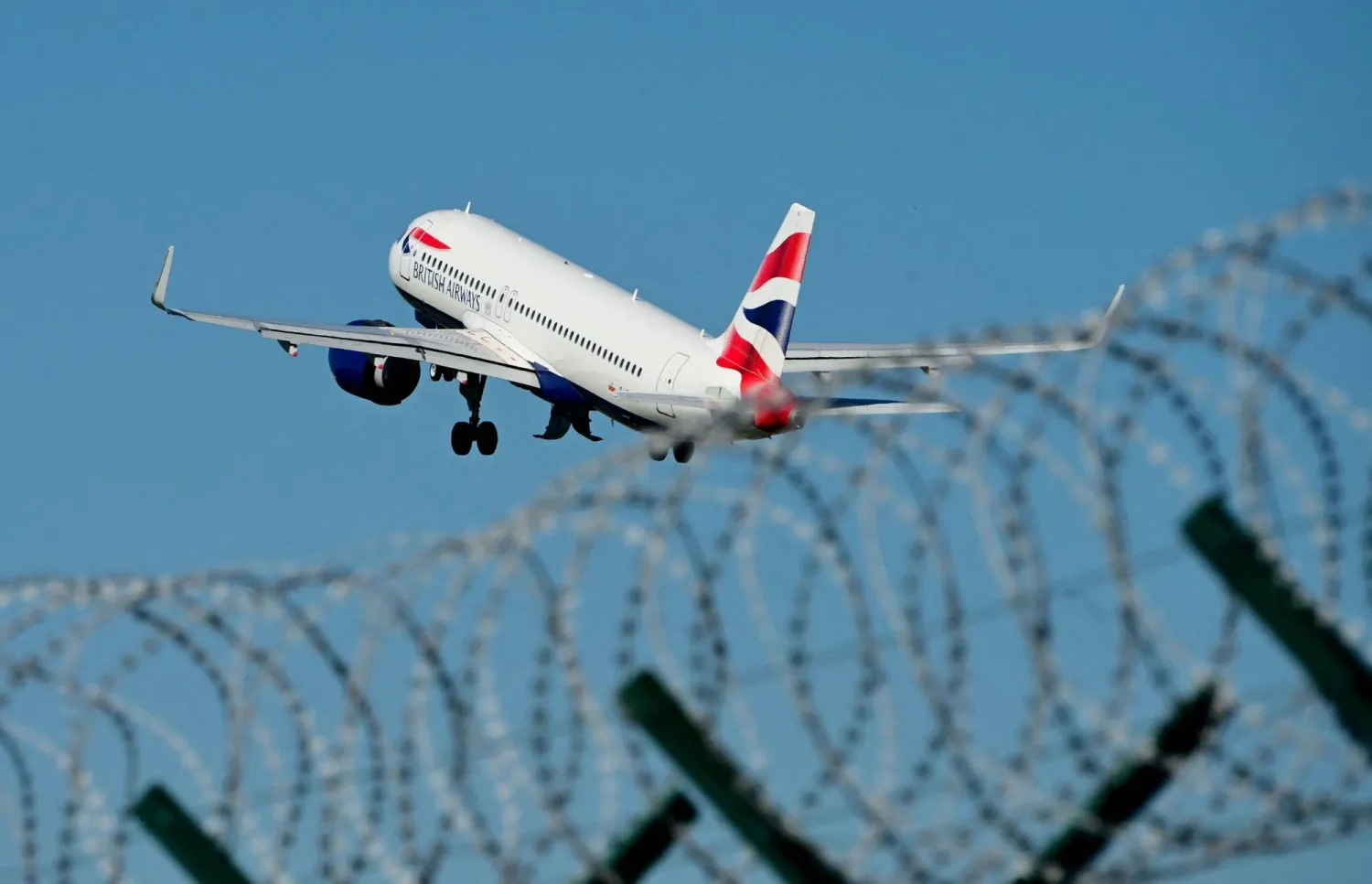 A British Airways plane takes off from Milan Linate airport northern Italy, on April 7, 2026. (Photo by Stefano RELLANDINI / AFP)