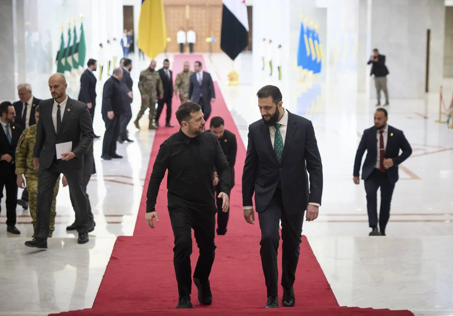 A handout photo made available by Presidential Press Service shows Ukrainian President Volodymyr Zelenskyy (L) and Syrian President Ahmed al-Sharaa (R) during their meeting in Damascus, Syria, 05 April 2026. (EPA/Presidential Press Service) 