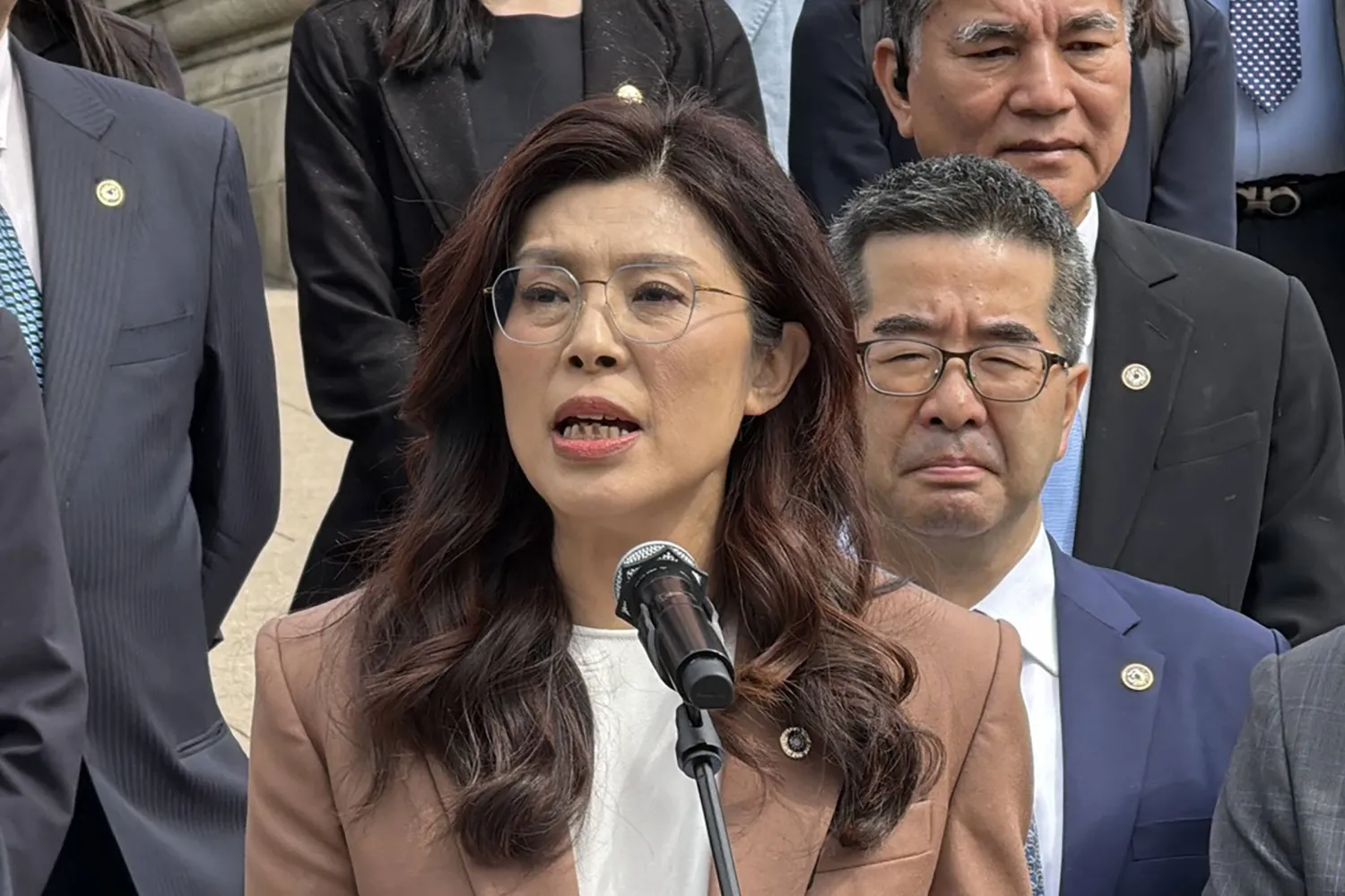 This picture taken and released by Taiwan's Central News Agency (CNA) on April 8, 2026, shows Kuomintang Chairperson Cheng Li-wen speaking to the press after a visit at the Sun Yat-Sen Mausoleum in Nanjing, in China's eastern Jiangsu province on April 8, 2026. (Central News Agency (CNA) / AFP) 
