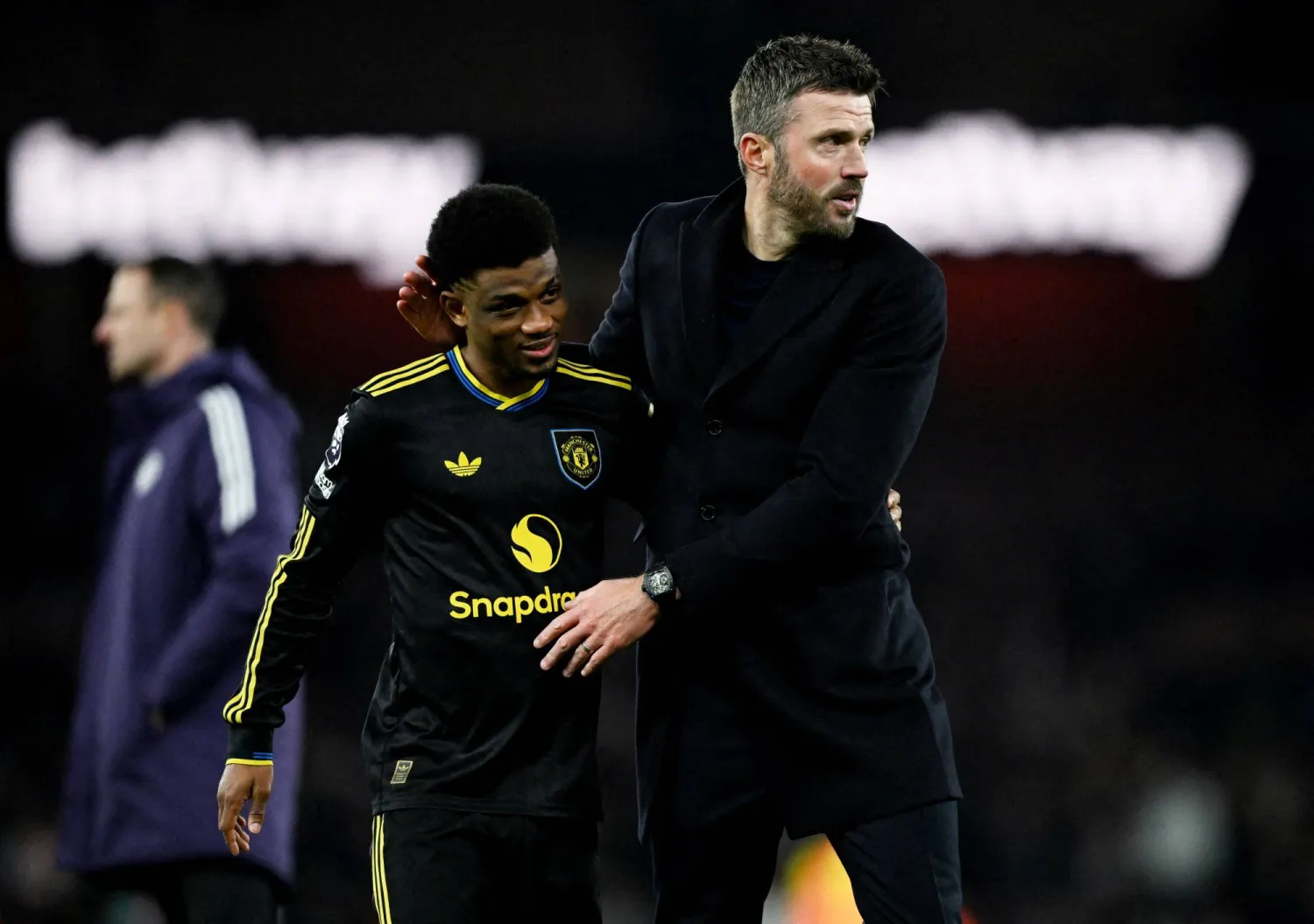 FILE PHOTO: Soccer Football - Premier League - Arsenal v Manchester United - Emirates Stadium, London, Britain - January 25, 2026 Manchester United's Amad Diallo celebrates after the match with Manchester United manager Michael Carrick. REUTERS/Dylan Martinez 
