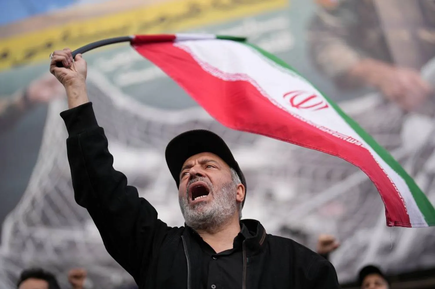  A government supporter chants slogans during a gathering after the announcement of a two-week ceasefire with the United States and Israel in Tehran, Iran, Wednesday, April 8, 2026. (AP) 