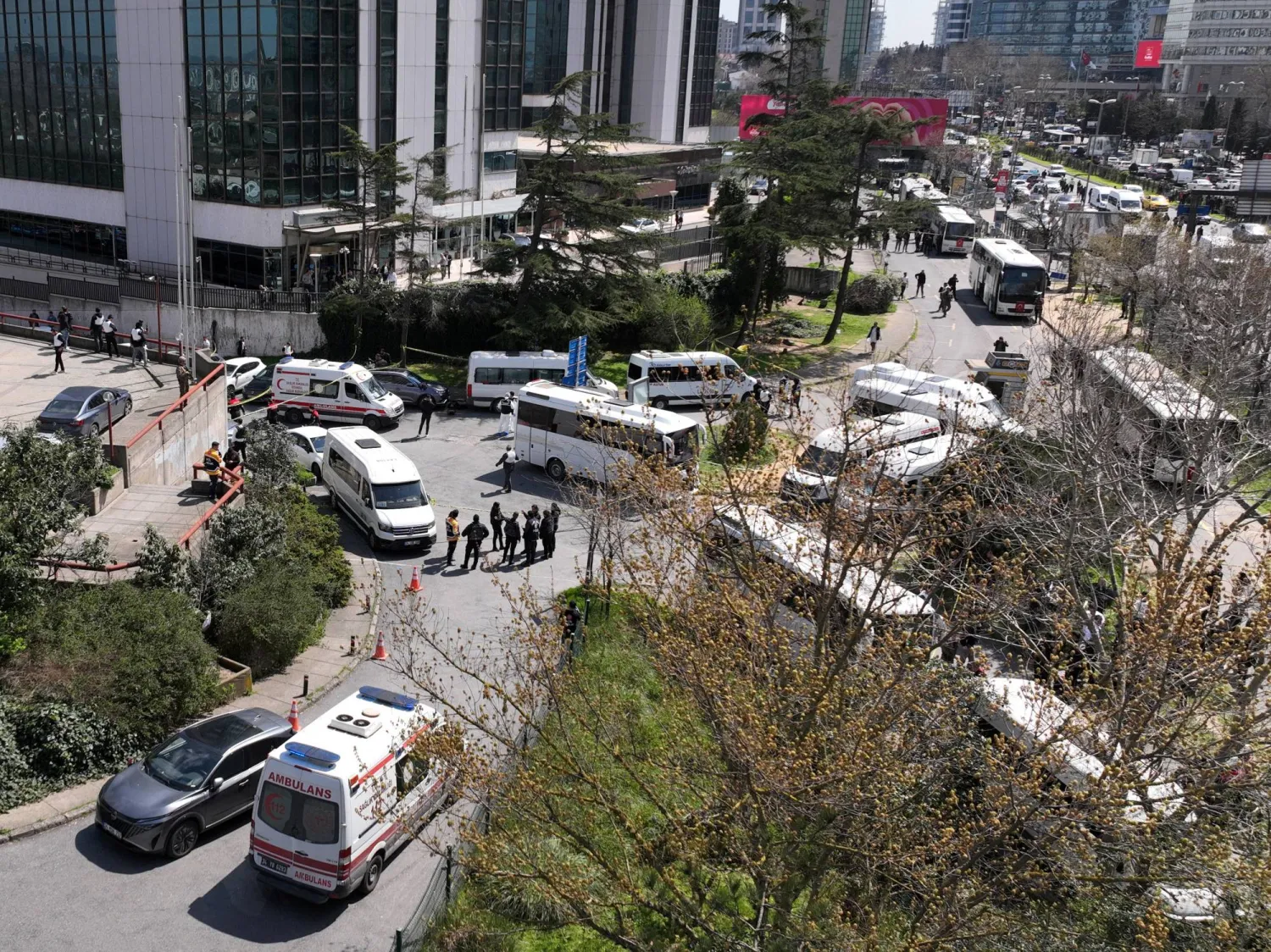 A drone view shows police officers and medics standing at the scene, after a gunfire was heard near the building housing the Israeli consulate, according to a witness, in Istanbul, Türkiye, April 7, 2026. REUTERS/Mehmet Emin Caliskan