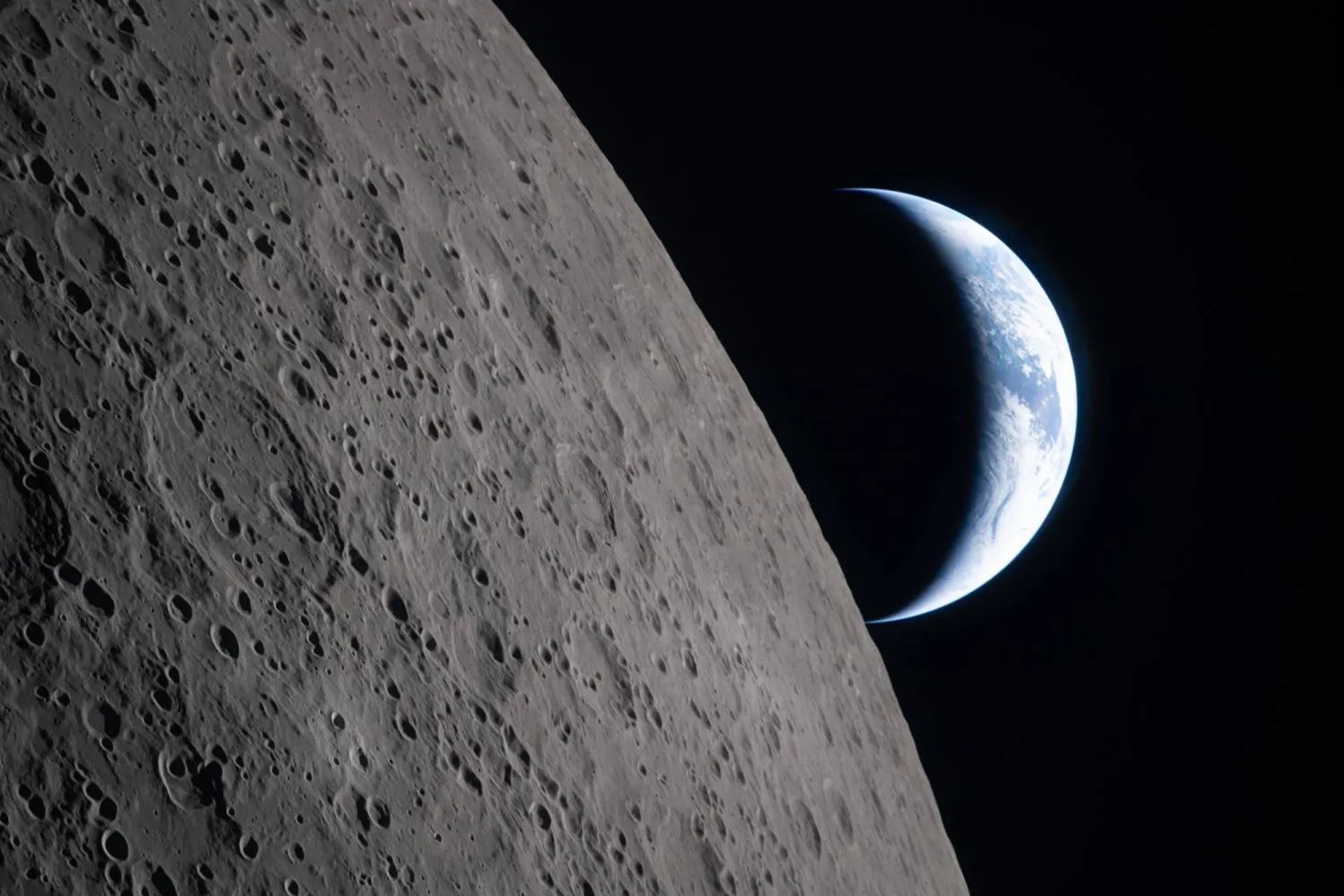In this image provided by NASA, the Artemis II crew captured this view as the Earth sets behind the Moon during a lunar flyby, Monday, April 6, 2026. (NASA via AP)