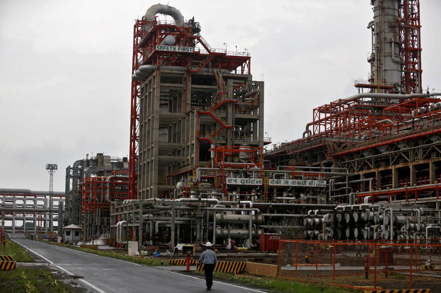 An employee walks inside the facilities of an oil refinery in Vadinar, in the western state of Gujarat, India (file- Reuters)