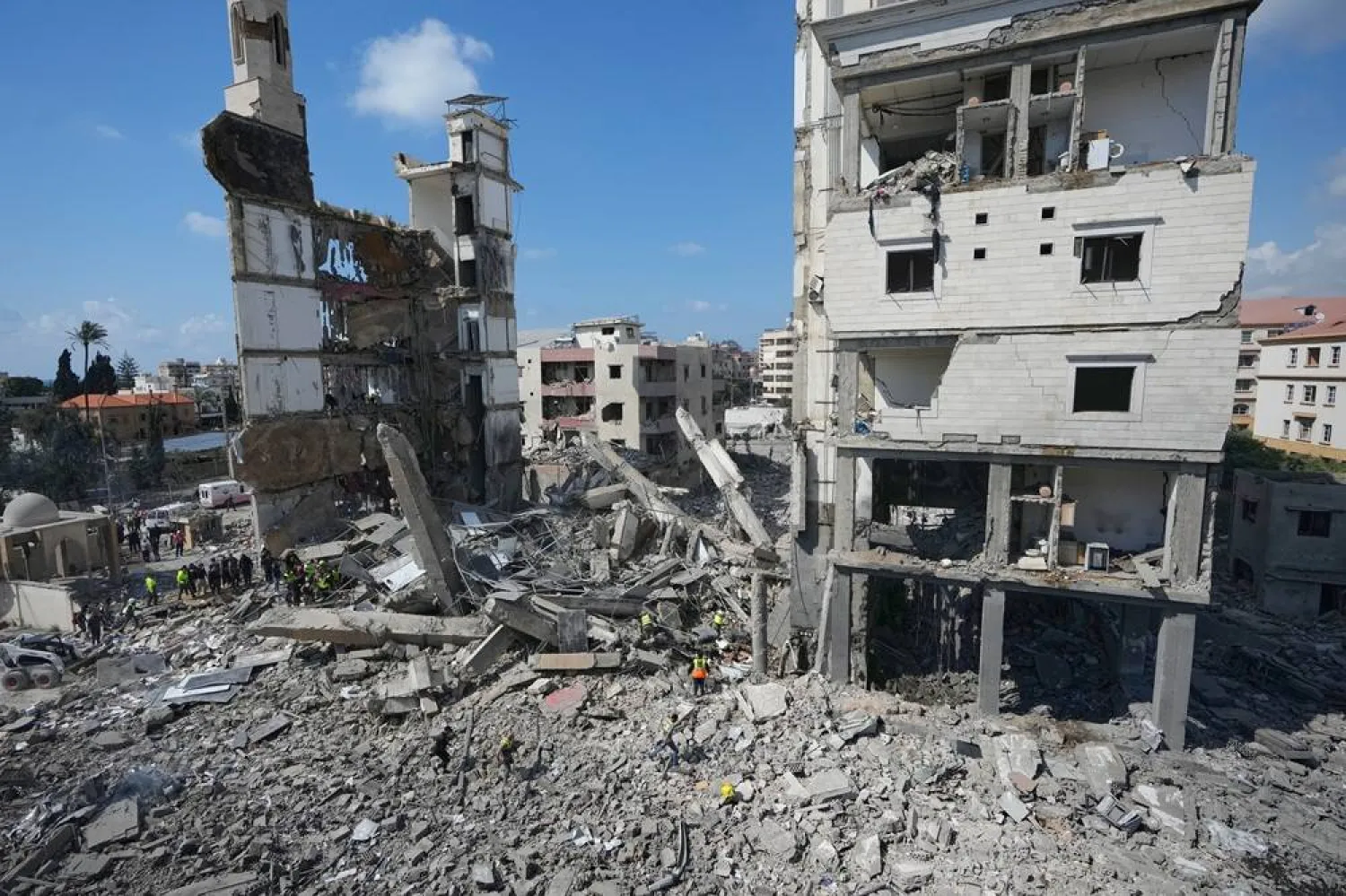 Rescuers gather on a destroyed religious complex that was hit in an Israeli airstrike in the southern port city of Sidon, Lebanon, Wednesday, April 8, 2026. (AP) 