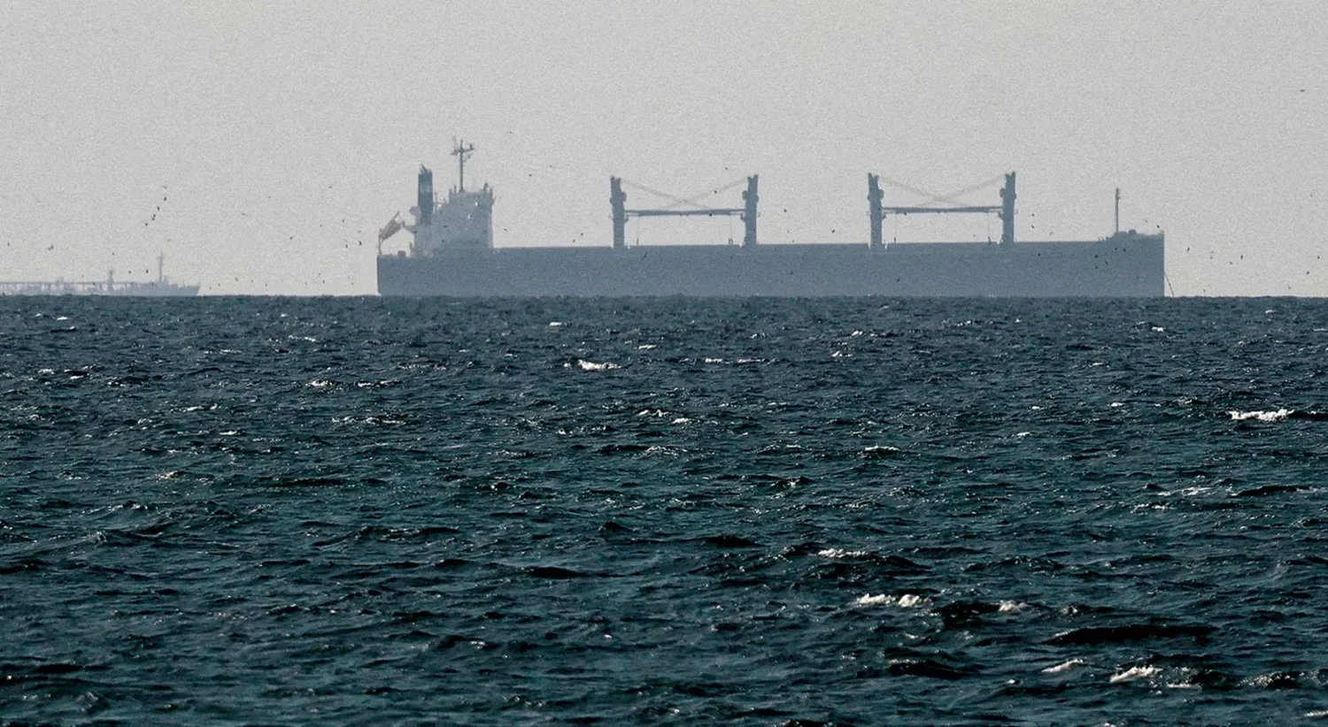 A cargo ship in the Arabian Gulf near the Strait of Hormuz (Reuters)