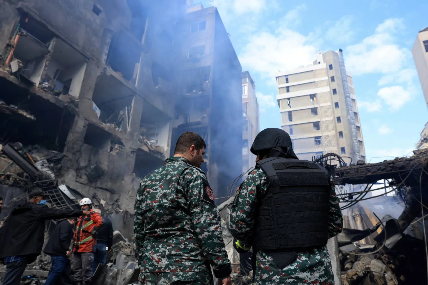 Rescuers stand at the site of an Israeli strike carried out on Wednesday, in Al-Mazraa in Beirut, Lebanon, April 9, 2026. REUTERS/Raghed Waked
